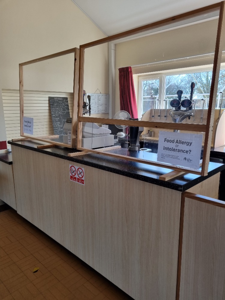 Windsor Hall service counter with protective barriers for safe catering events in Skipsea.