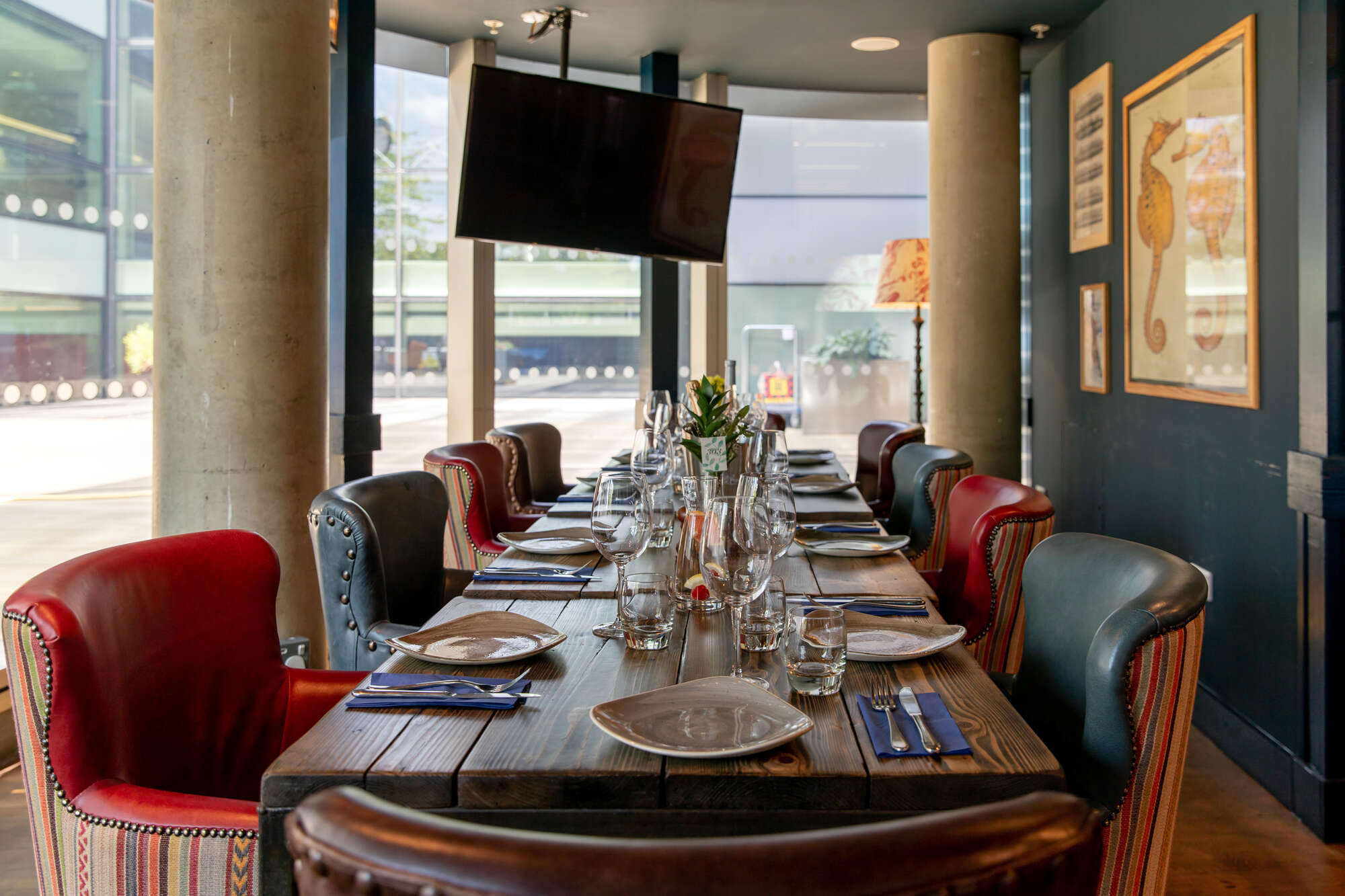 Elegant dining setup in The Oyster Shed for meetings and events with natural light.