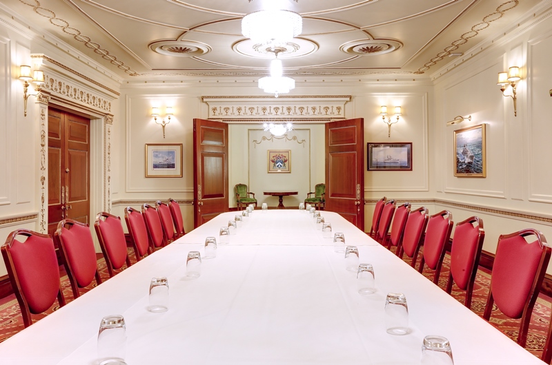 Humber Room at Plaisterers’ Hall: elegant meeting space with plush red chairs for corporate events.