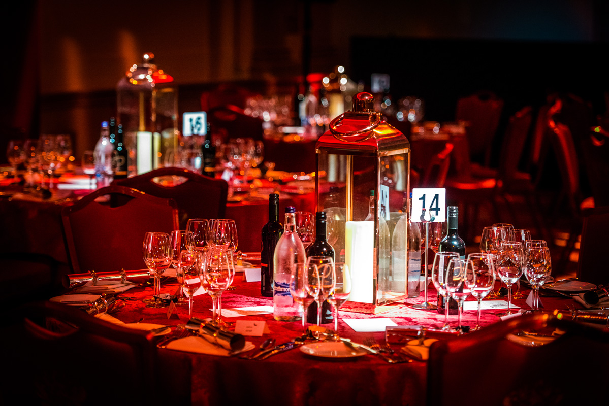 Elegant banquet table with red tablecloth for Christmas parties at Plaisterers' Hall.