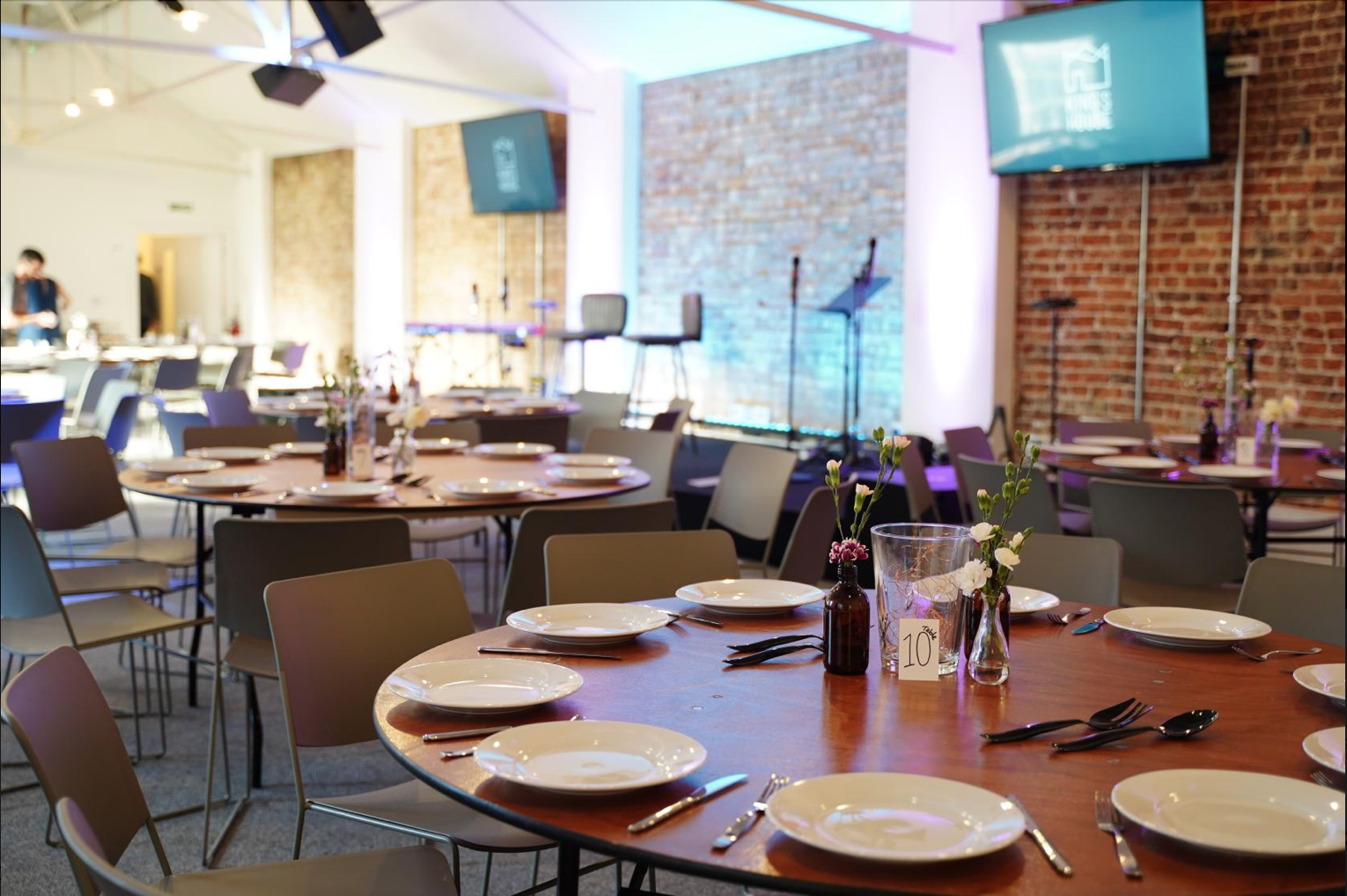 Whole Venue in King's House with round tables, ideal for corporate meetings and social events.