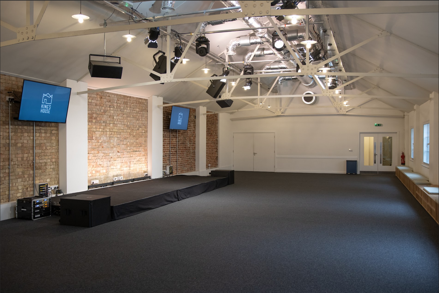 Versatile King's House venue with high ceilings for conferences and workshops.