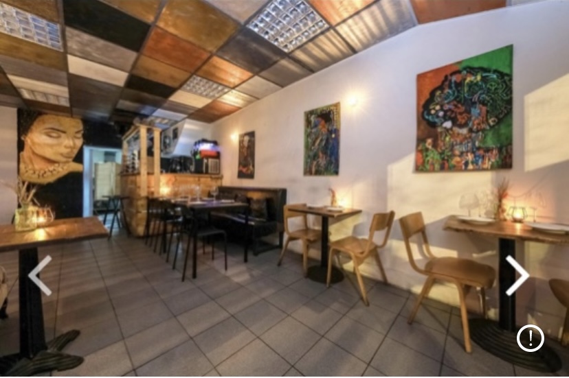 Cozy dining space with eclectic decor for intimate gatherings and small events.