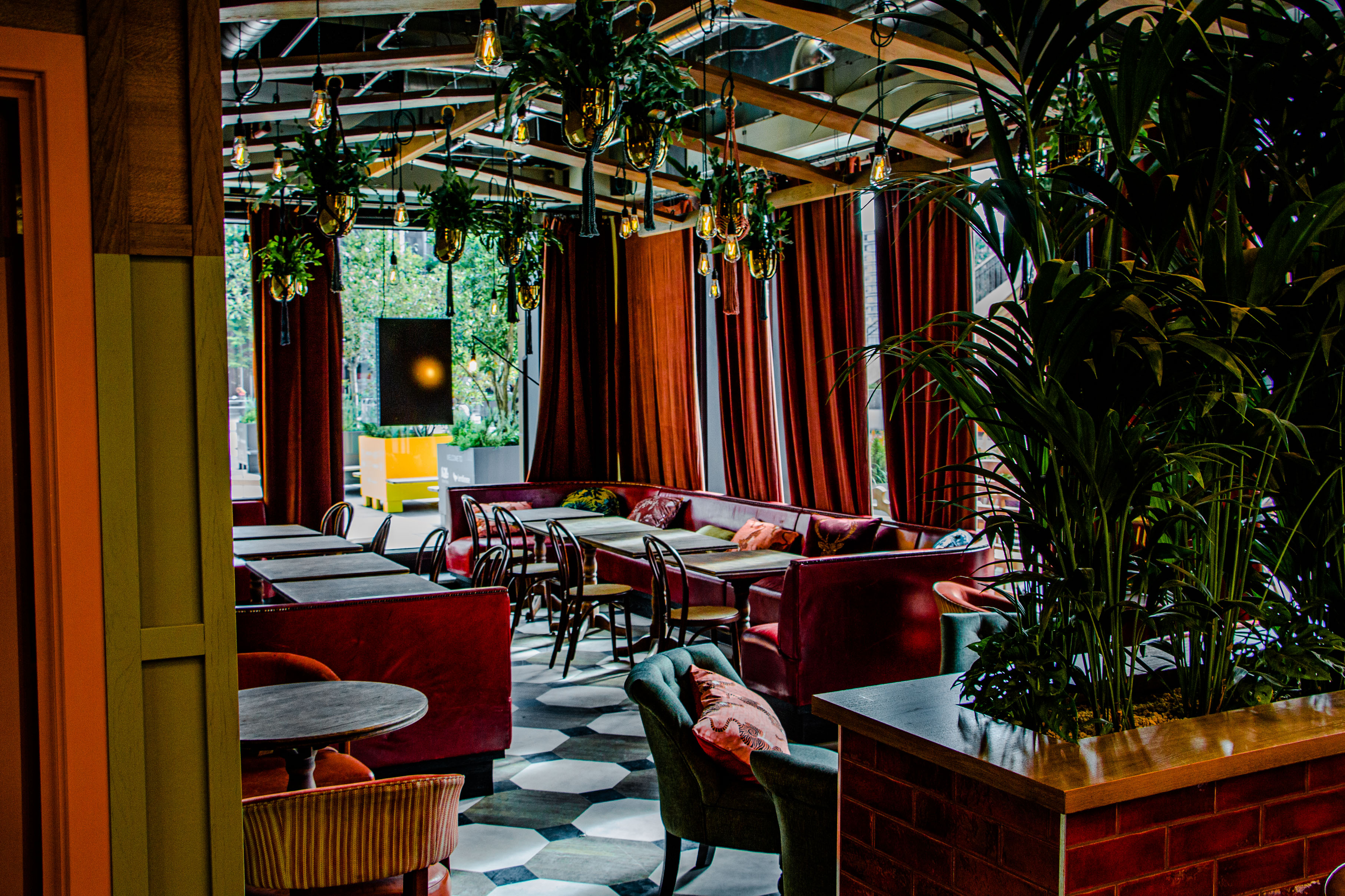 Stylish event space with cozy seating and vibrant decor for networking events.