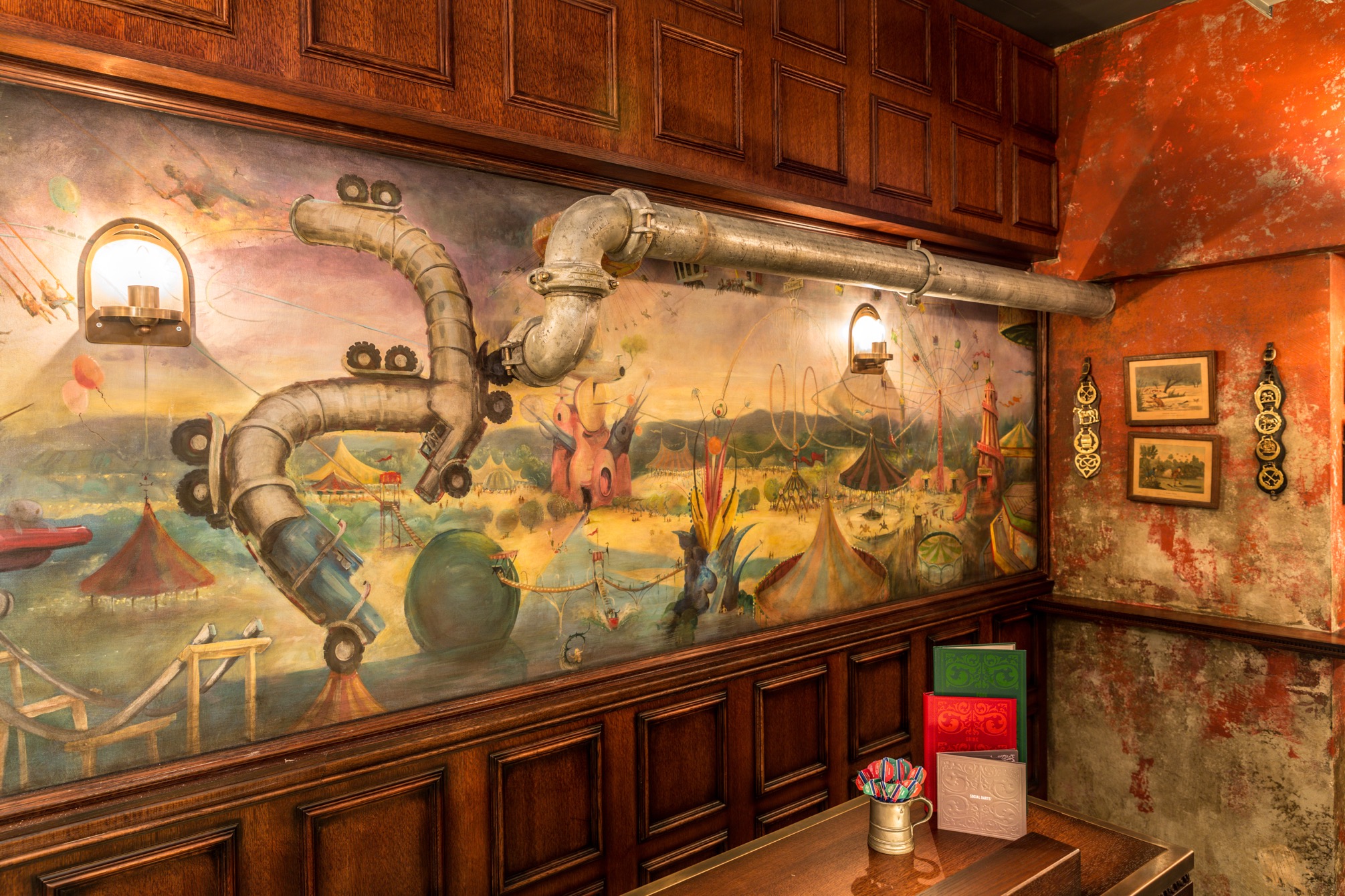 Fairground at Flight Club Bloomsbury with vibrant mural, ideal for creative events.
