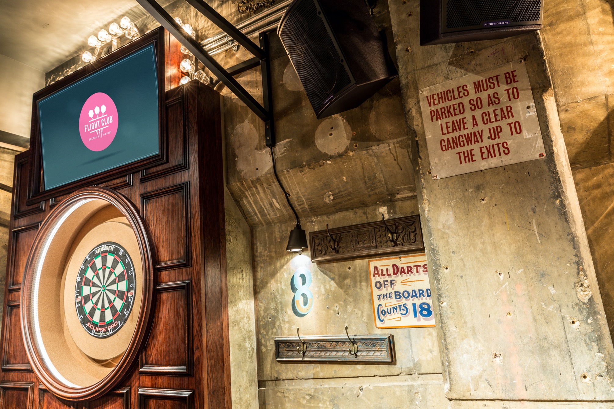 Vibrant dartboard event space at Flight Club Bloomsbury for networking and team-building.