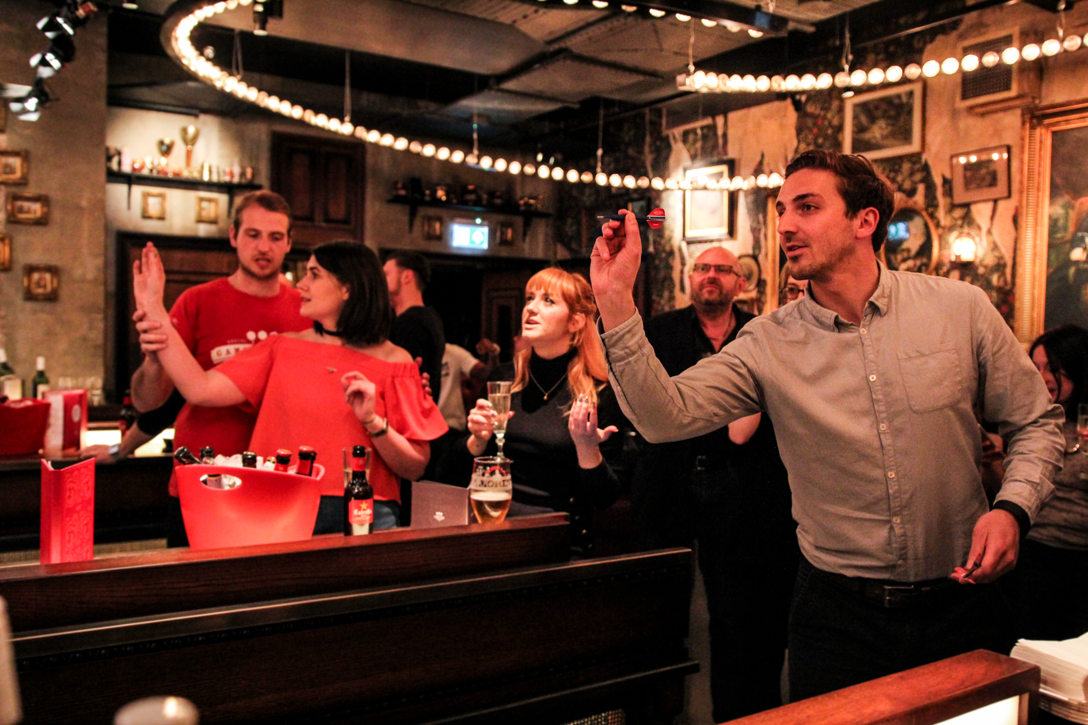 Lively social event at Flight Club Bloomsbury with warm lighting and networking opportunities.