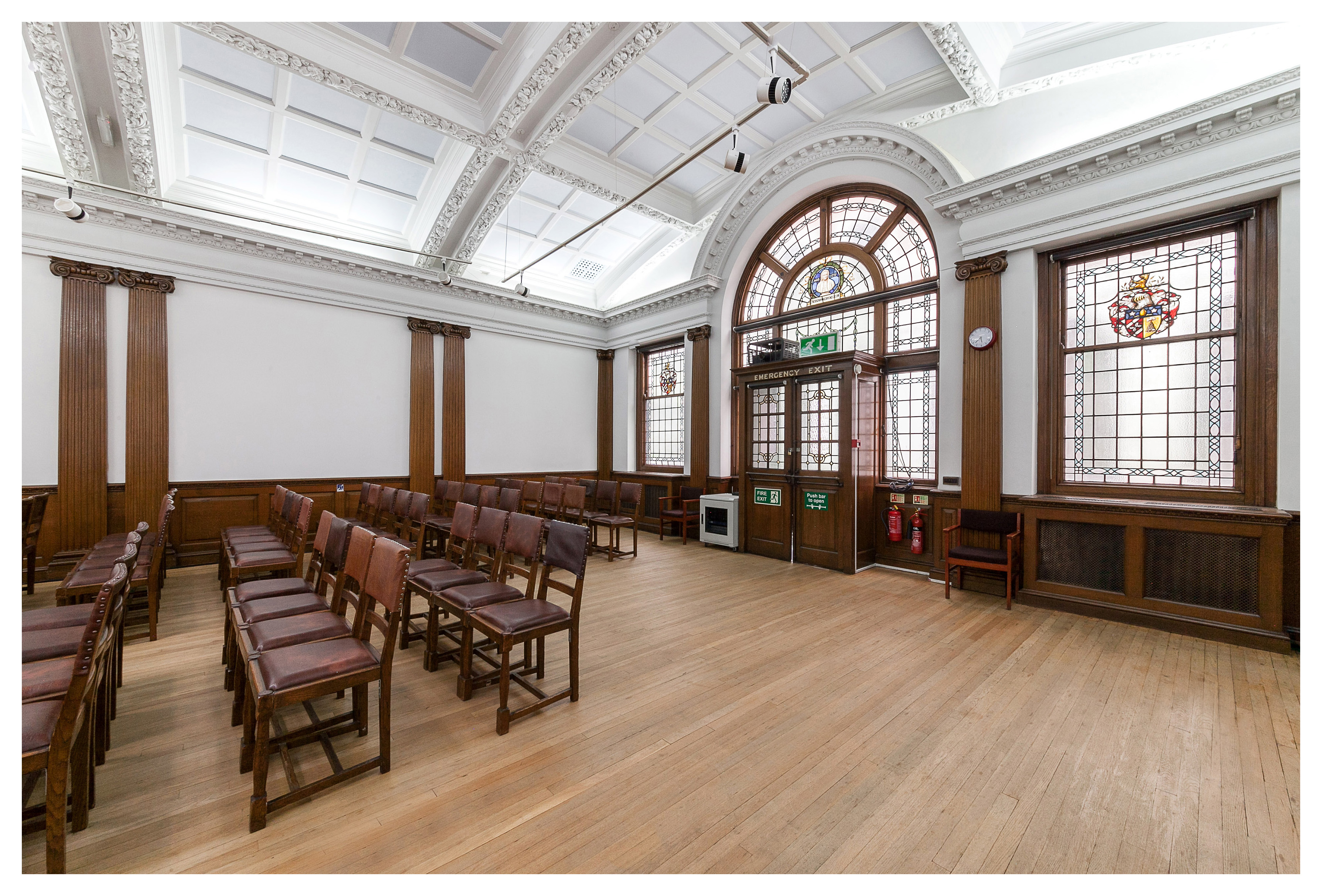 Elegant Swedenborg Hall meeting space with wooden chairs, ideal for workshops and gatherings.
