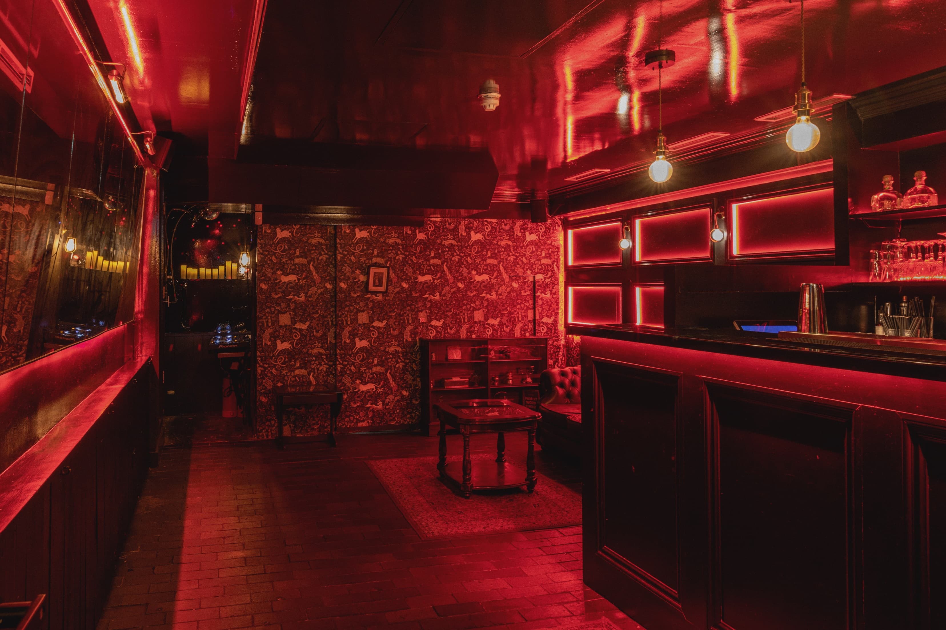 Stylish dimly lit venue with plush seating for intimate gatherings and exclusive events.