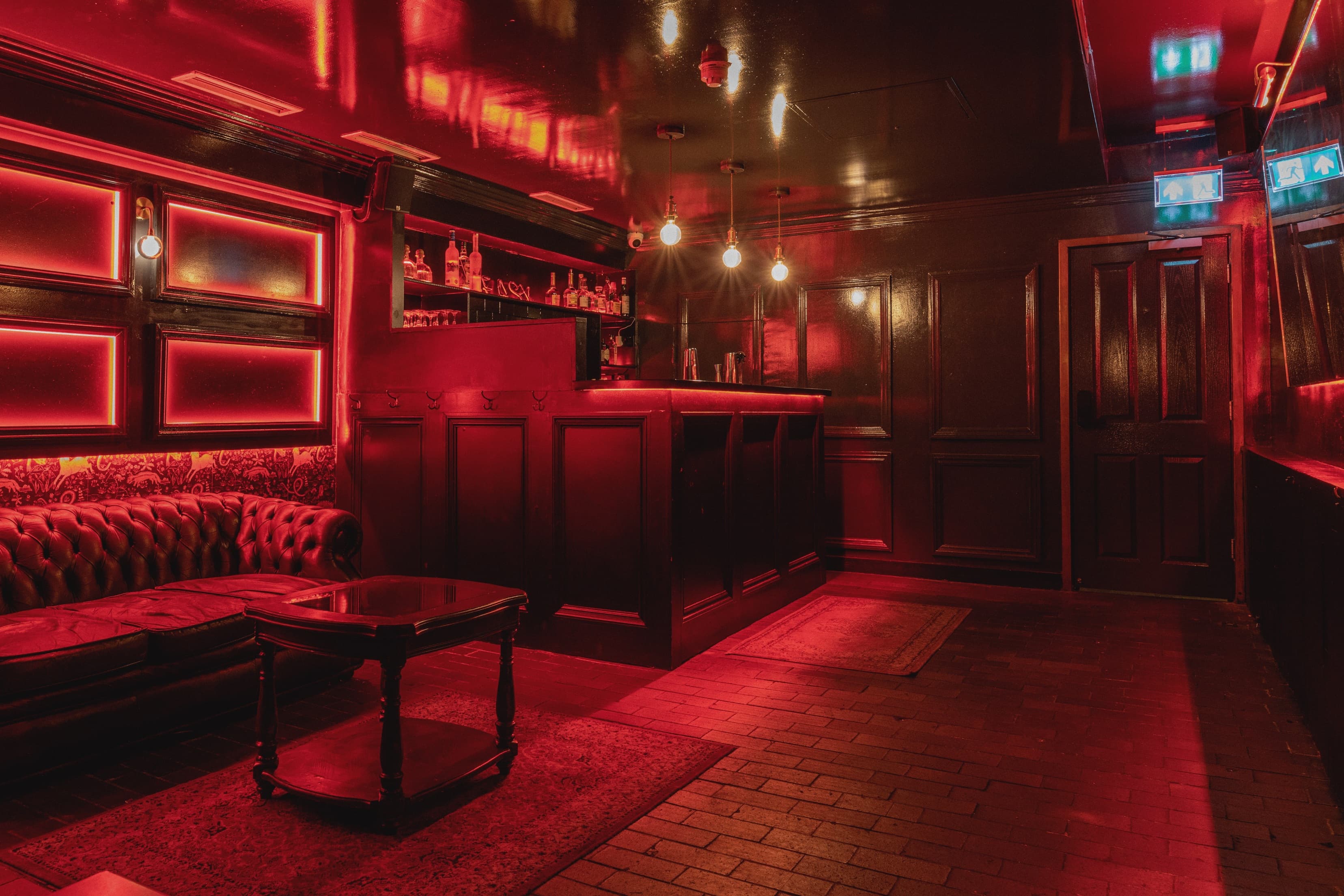 Stylish venue with red ambiance, perfect for cocktail receptions and private events.