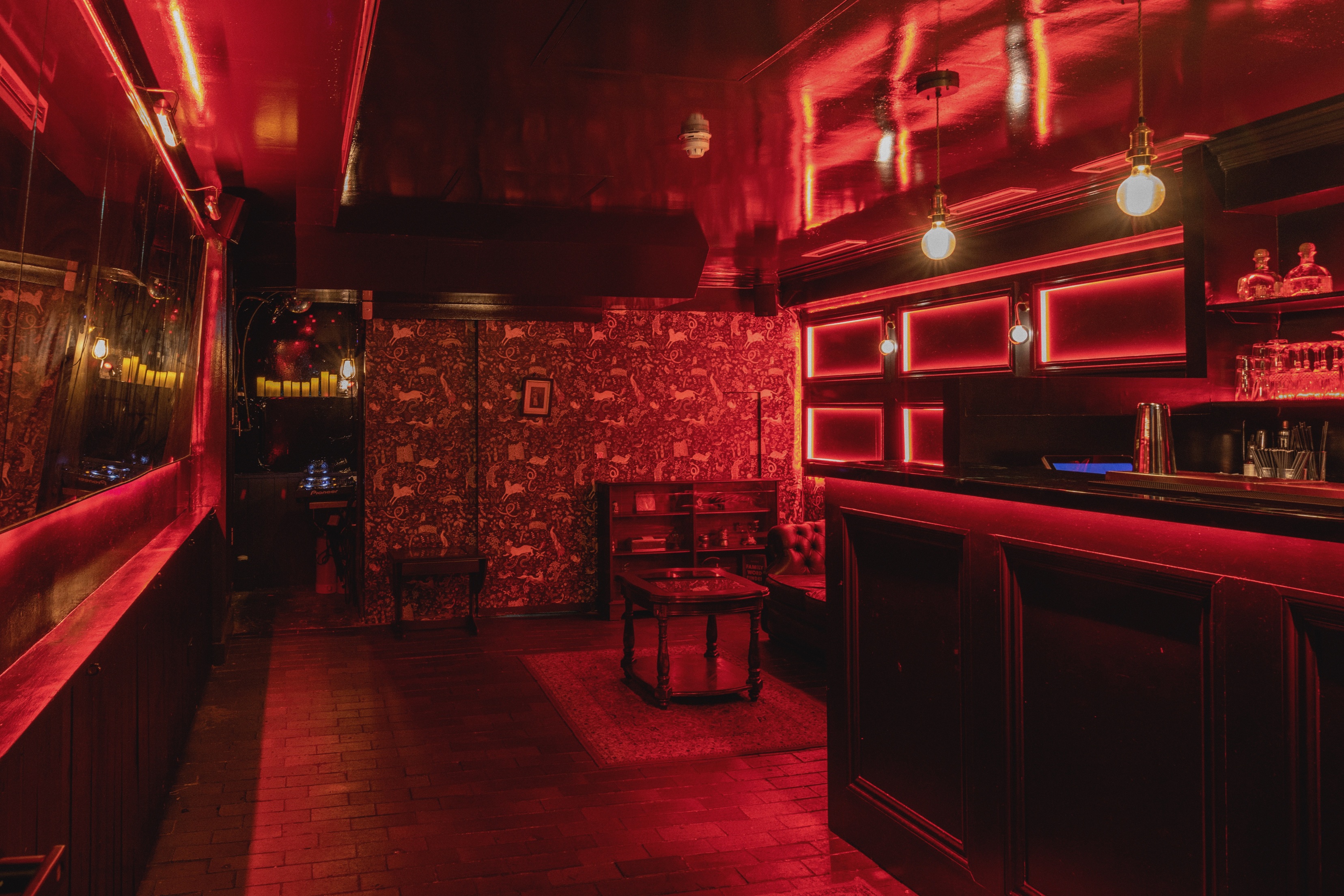 Stylish Beasy Soho venue with warm red ambiance for intimate gatherings and events.