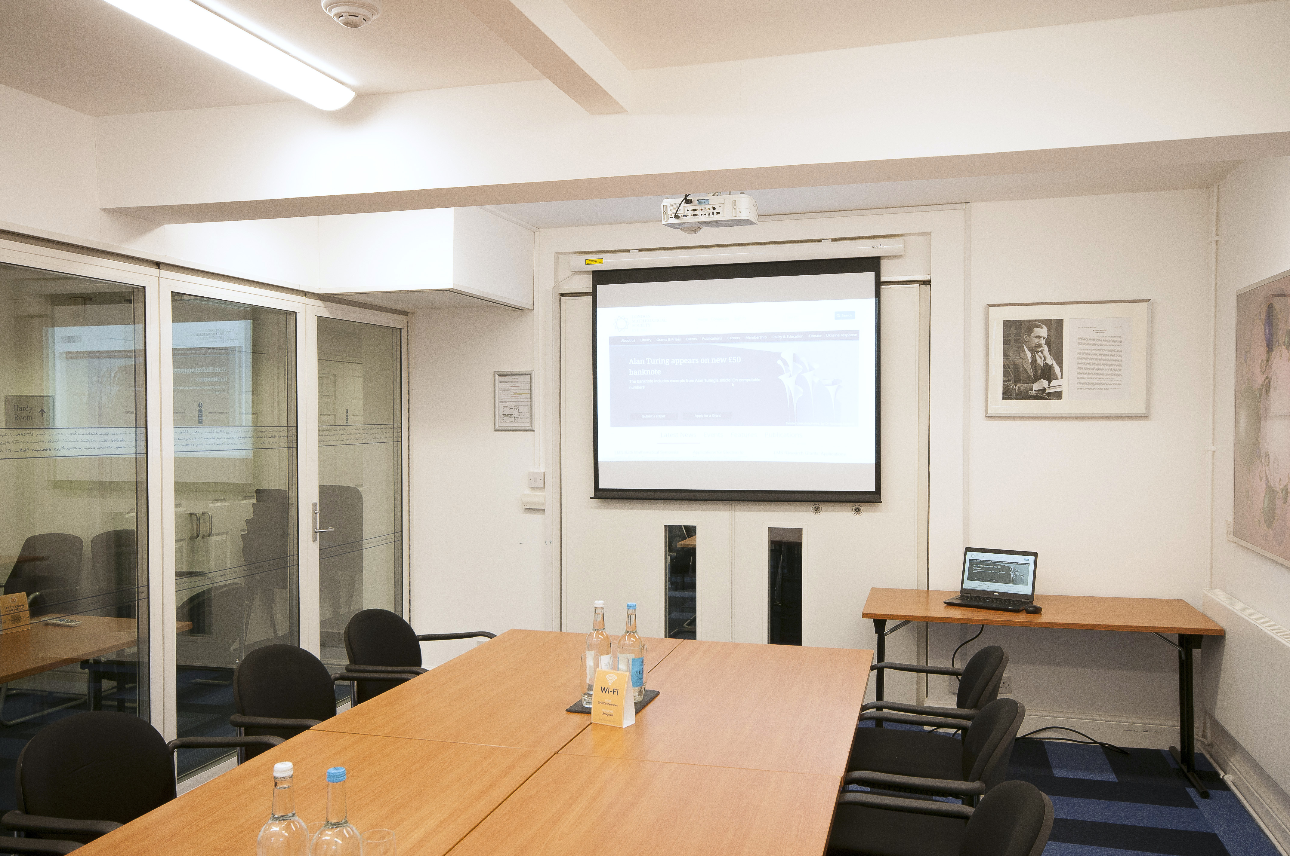 Burnside Room in De Morgan House: modern meeting space with large table, ideal for workshops.
