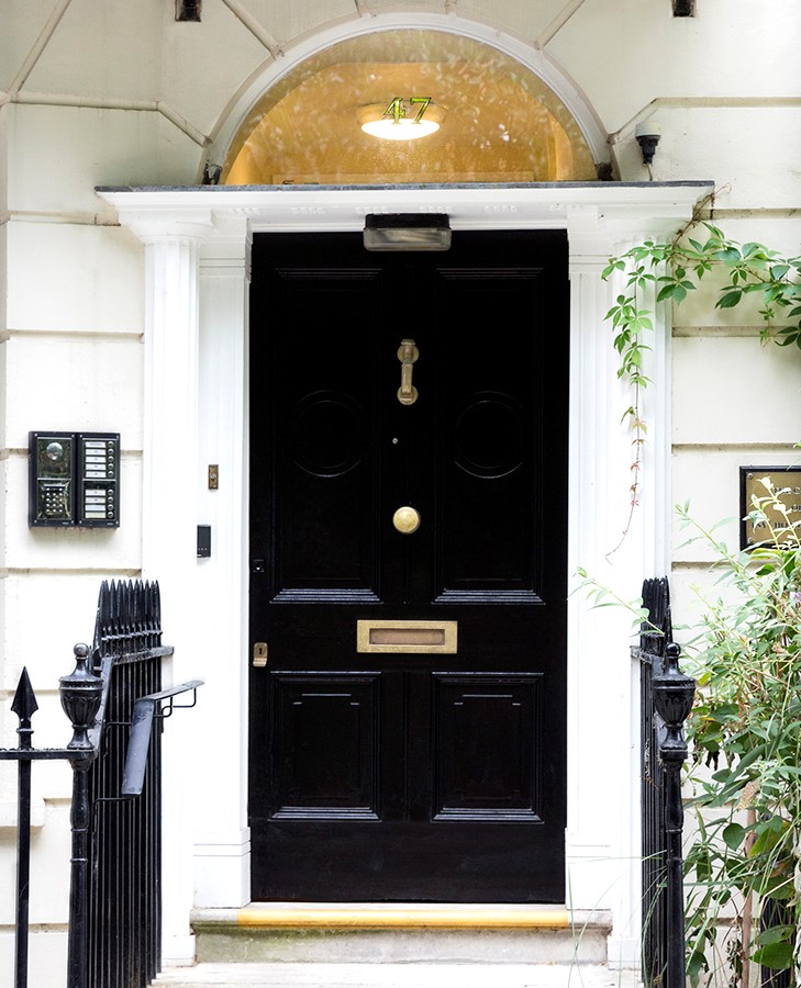 Elegant black entrance door at Guild Hall, perfect for networking events and gatherings.