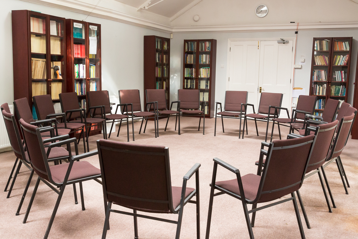 Guild Hall meeting space with circular chairs, ideal for workshops and discussions.