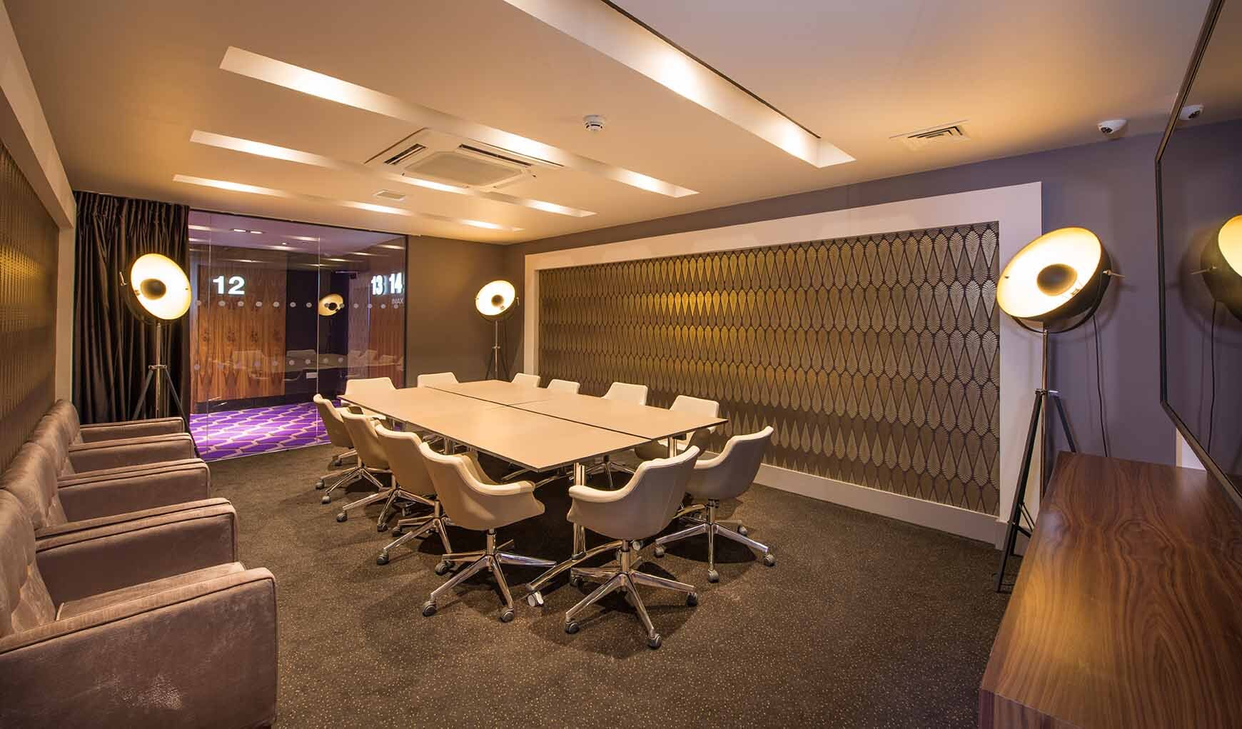 Modern meeting room with ergonomic chairs at ODEON Milton Keynes for professional events.