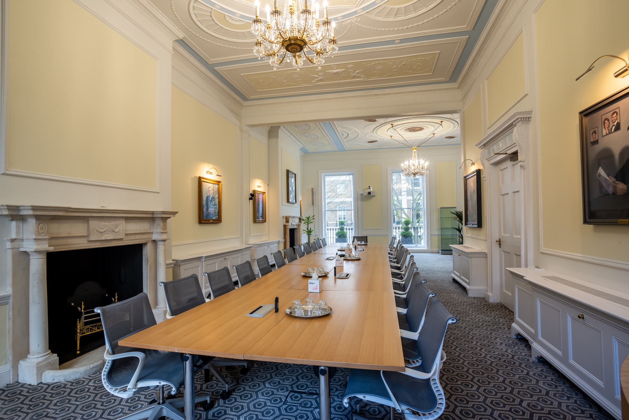 Intavent Suite meeting room with wooden table, ideal for corporate events and brainstorming.