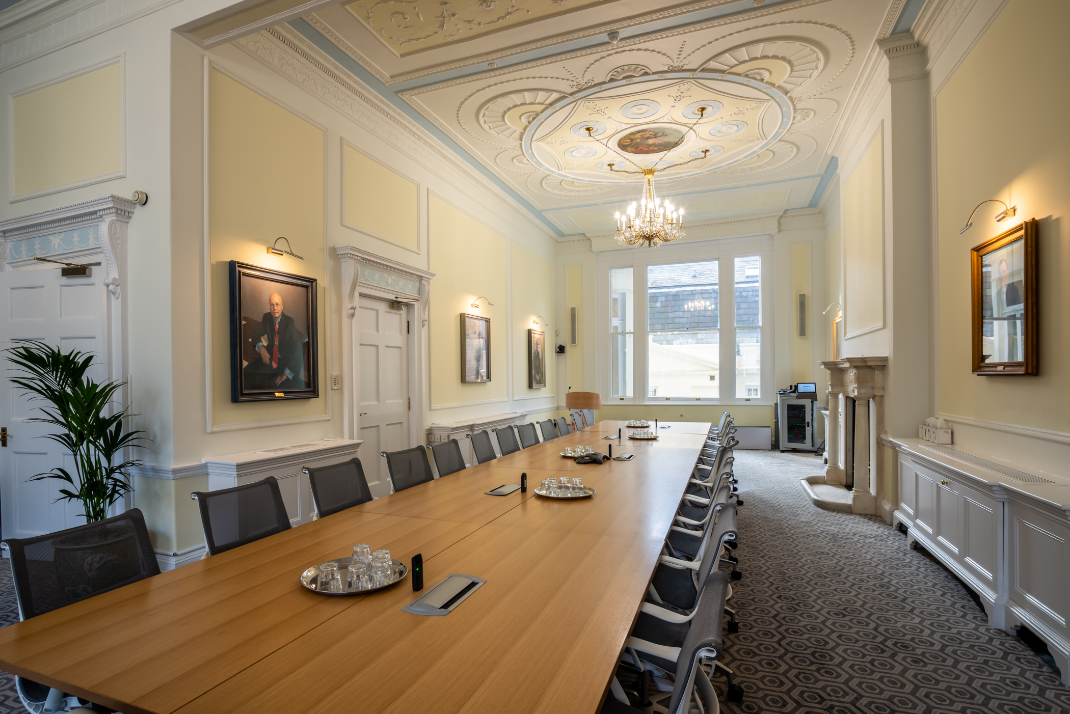 Sophisticated meeting room with wooden table at Intavent Suite, ideal for board meetings.