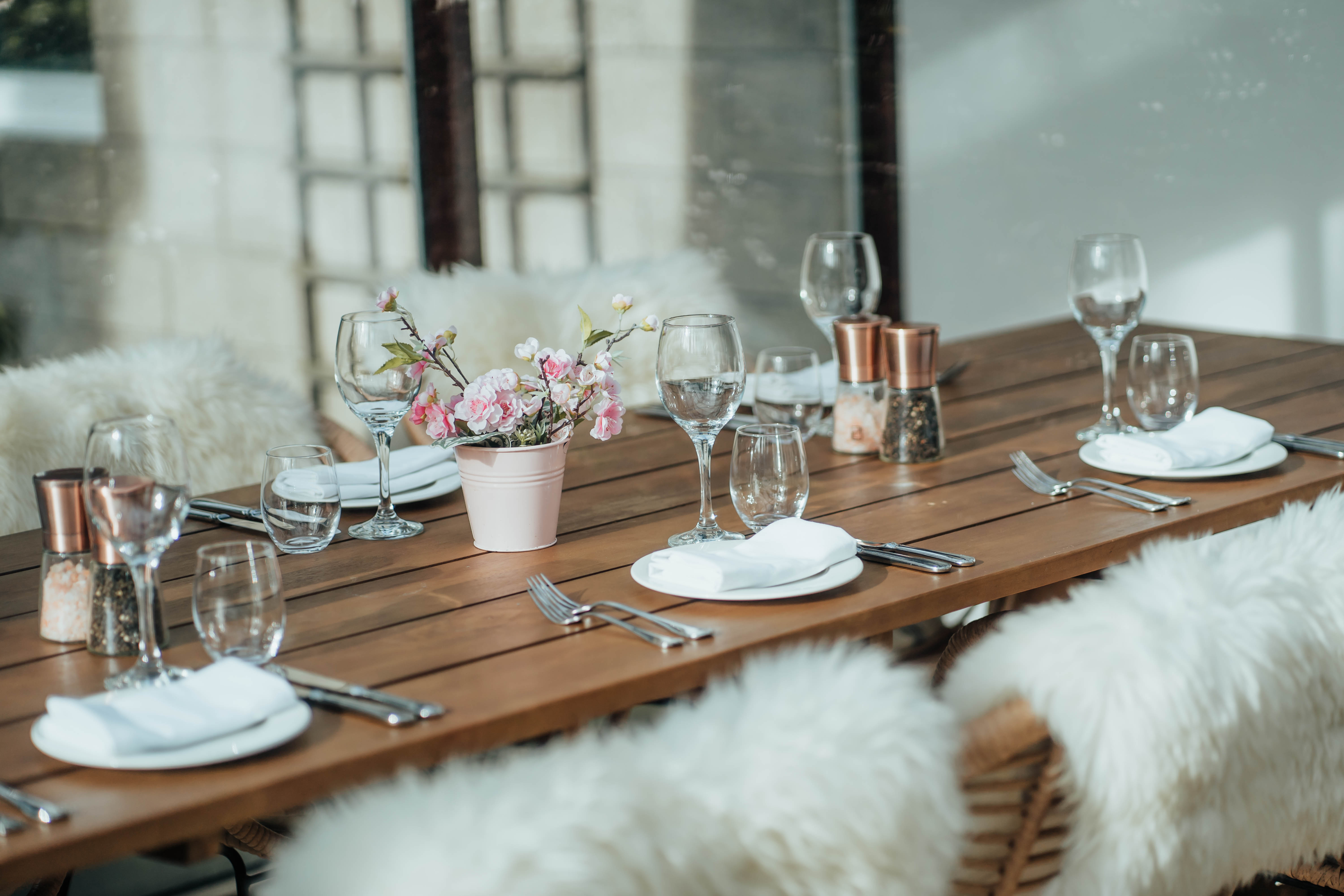 Elegant dining table with fresh flowers at Club Prive Conservatory, Edinburgh event venue.