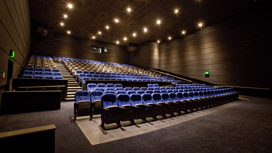 Modern auditorium with tiered seating for conferences and screenings at ODEON Trafford Centre.