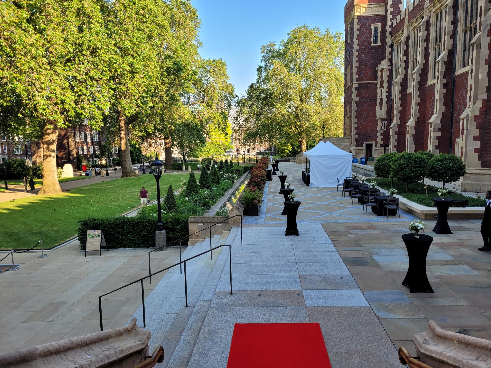Summer events at Lincoln's Inn: elegant terrace with manicured gardens and stylish decor.
