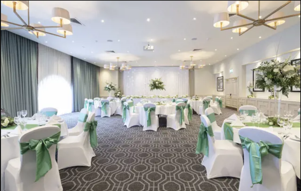 Wisteria wedding venue with elegant tables and floral arrangements for formal gatherings.