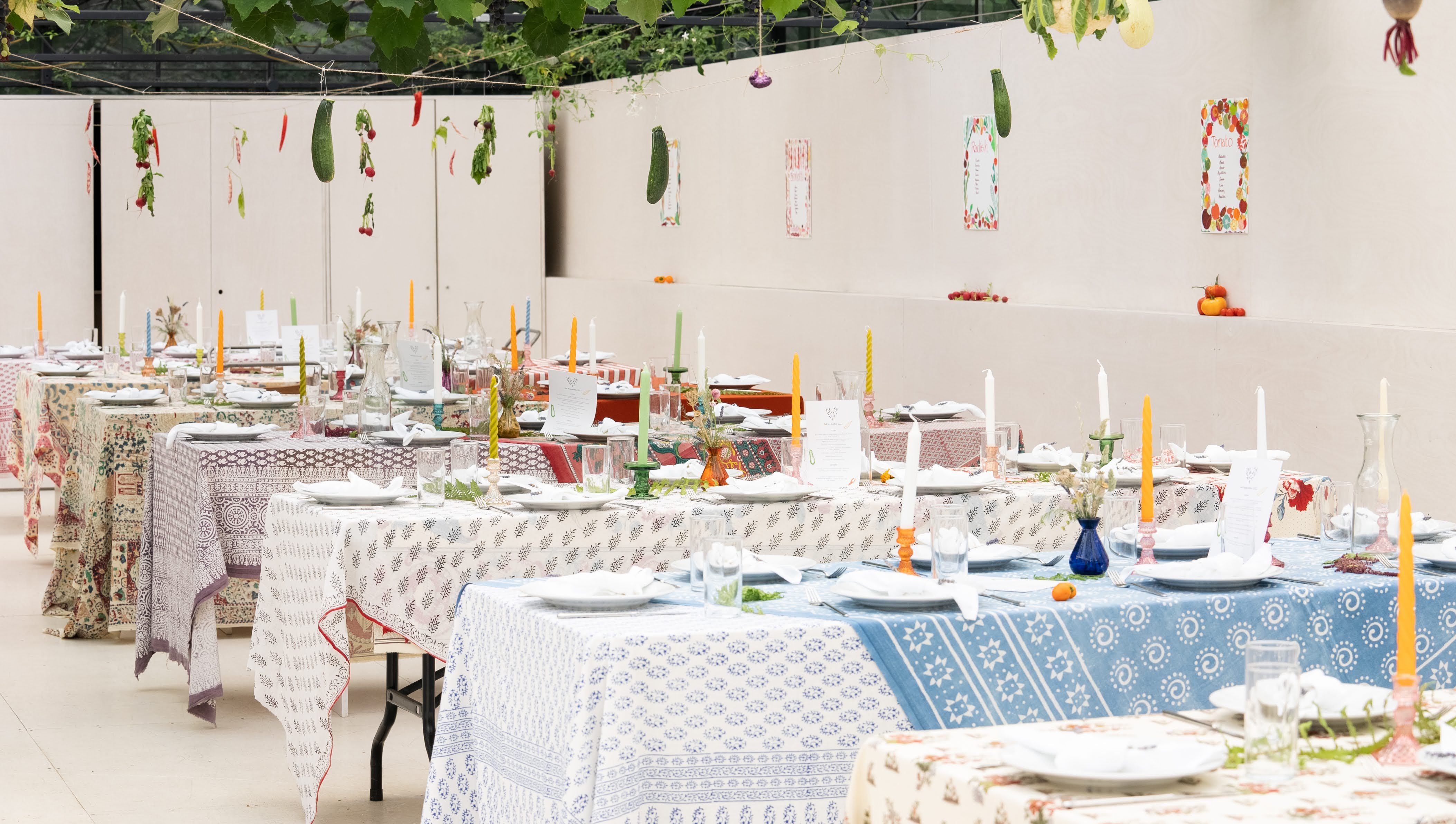 Elegant event space with colorful tables and greenery at Omved Gardens. Perfect for gatherings.