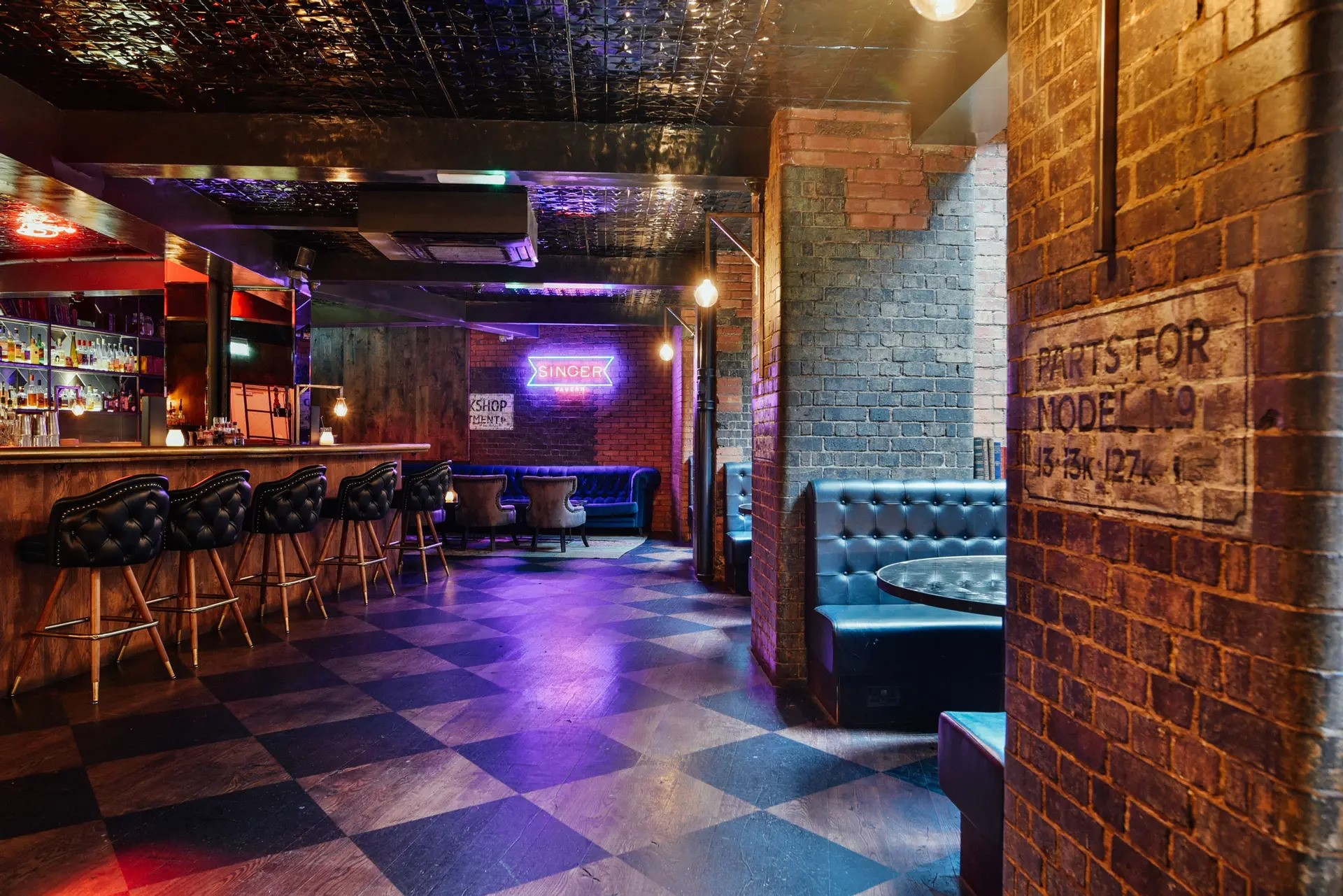 Stylish 5CC Cocktail Bar with exposed brick, ideal for networking events and gatherings.