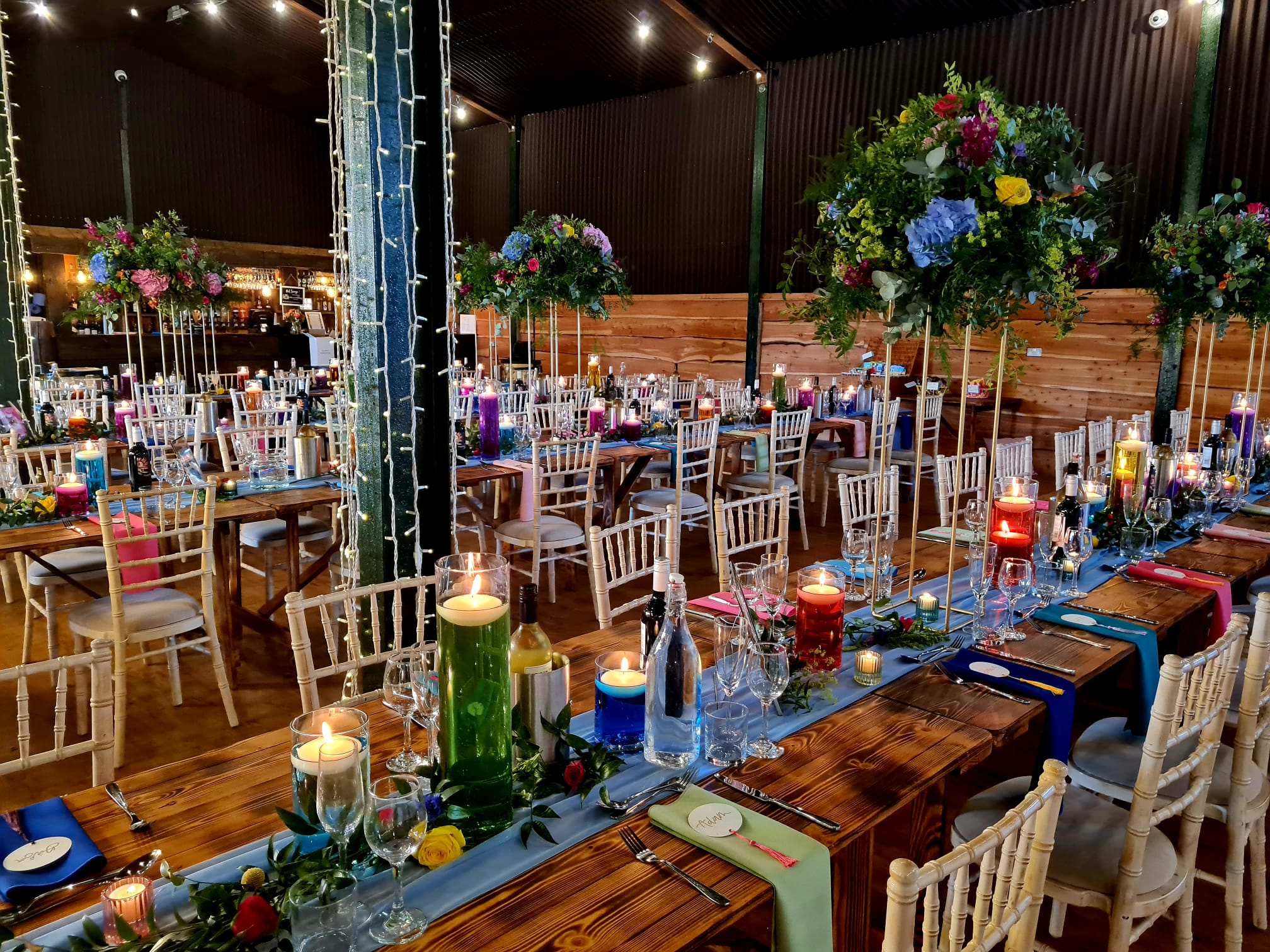 Elegant event space at Stock Farm Barn with floral centerpieces for weddings and gatherings.