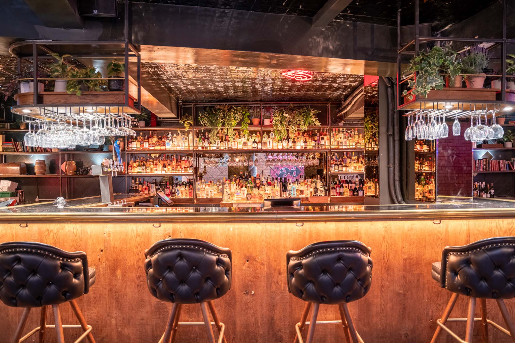 Stylish 5CC Cocktail Bar with warm lighting, ideal for networking events and receptions.