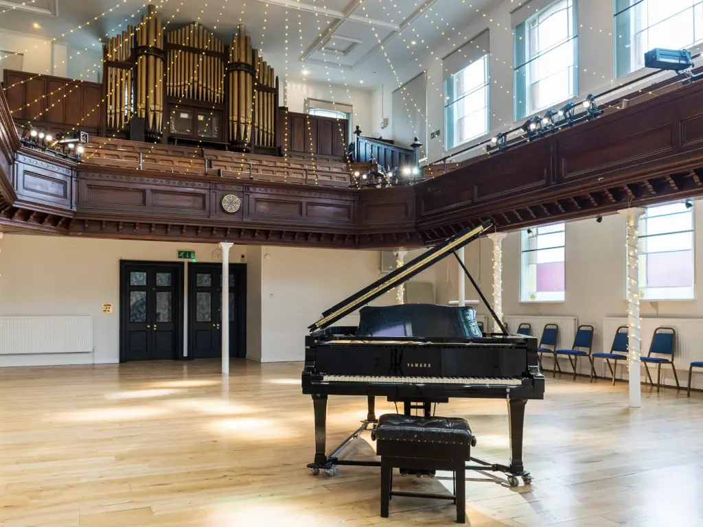 Elegant event space in The Amadeus with grand piano, perfect for concerts and receptions.