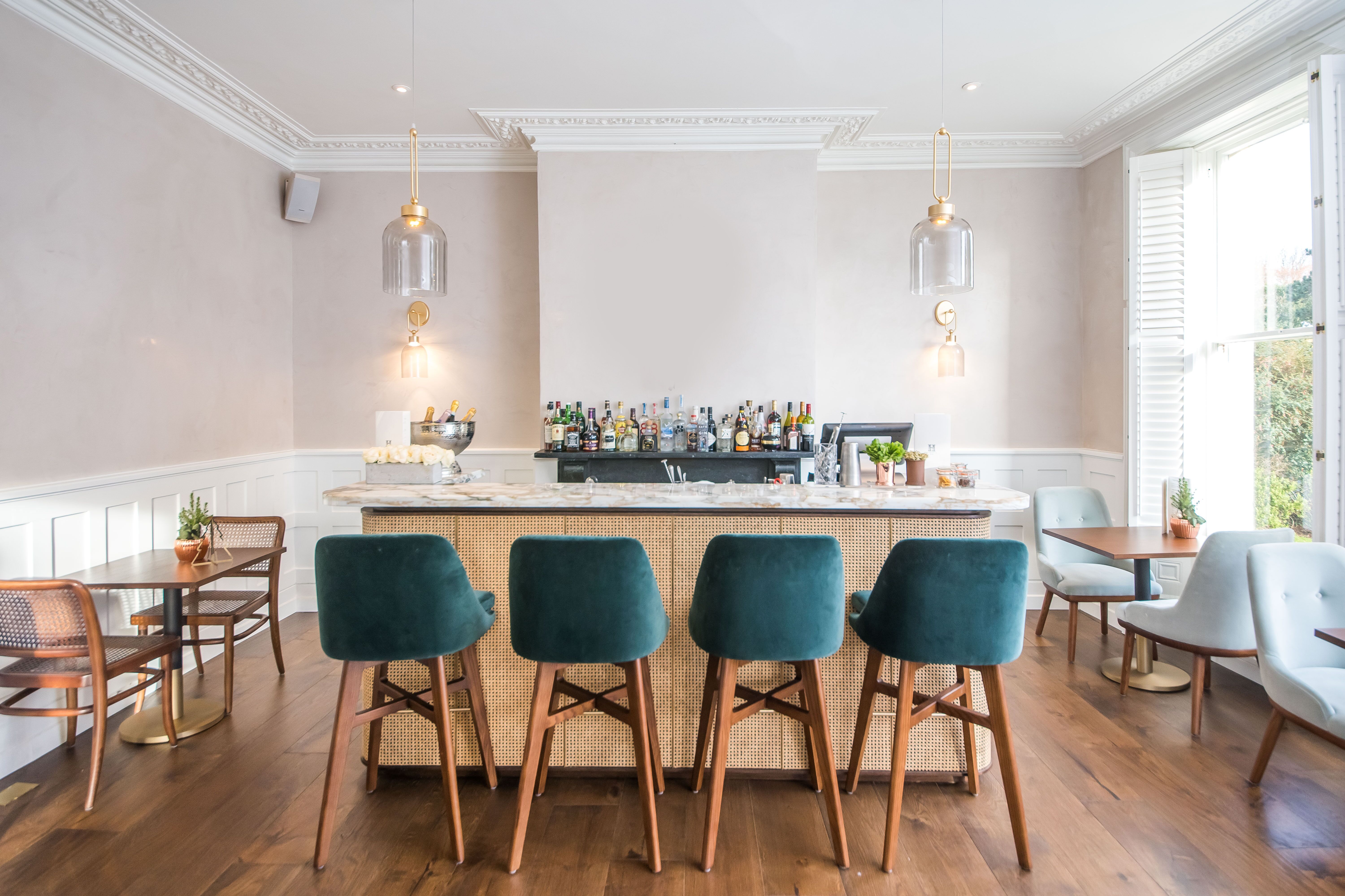 Stylish bar area at Henrietta Bar & Garden, ideal for cocktail receptions and networking events.