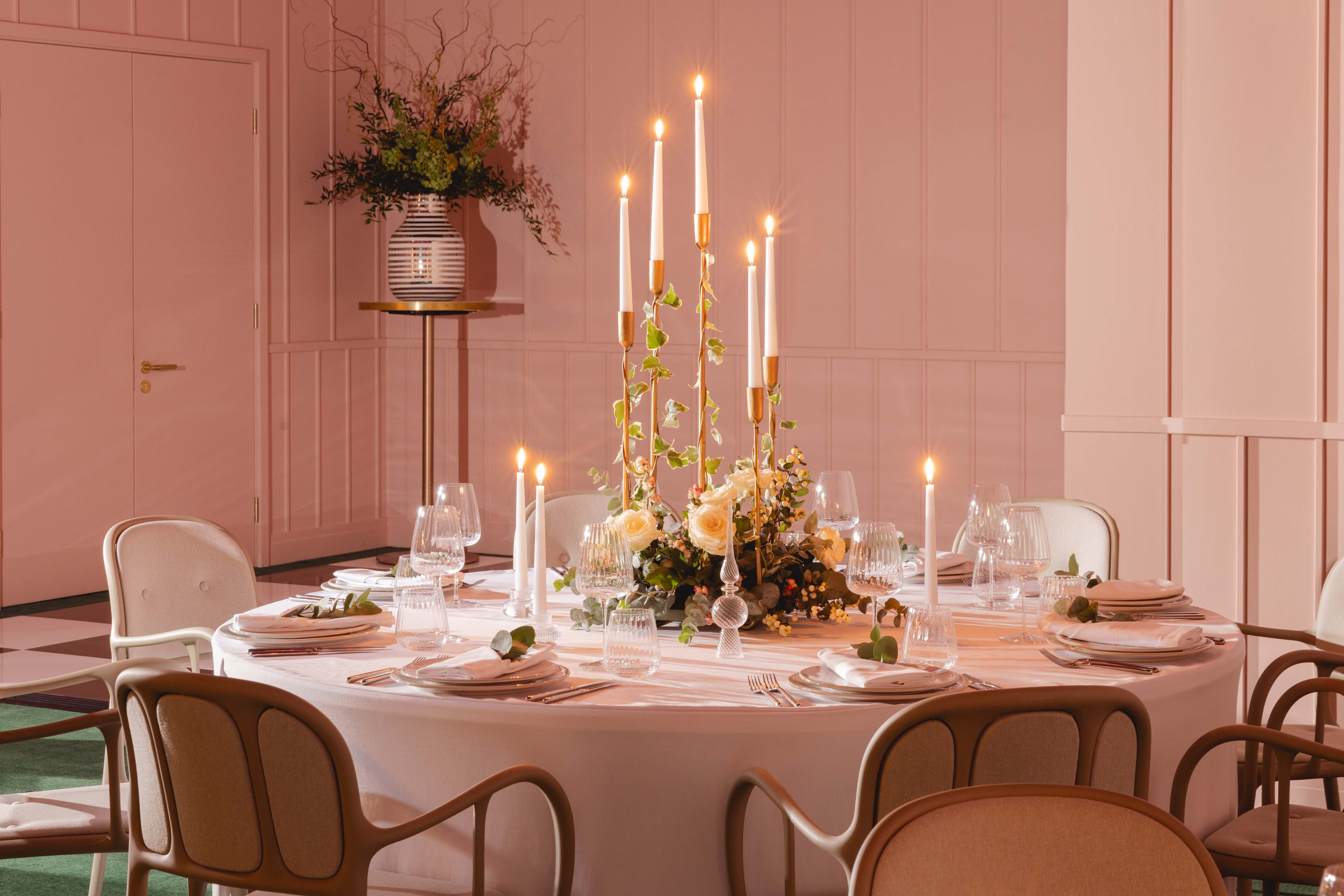 Elegant round table with floral centerpiece in Creative Room 1, perfect for weddings and events.