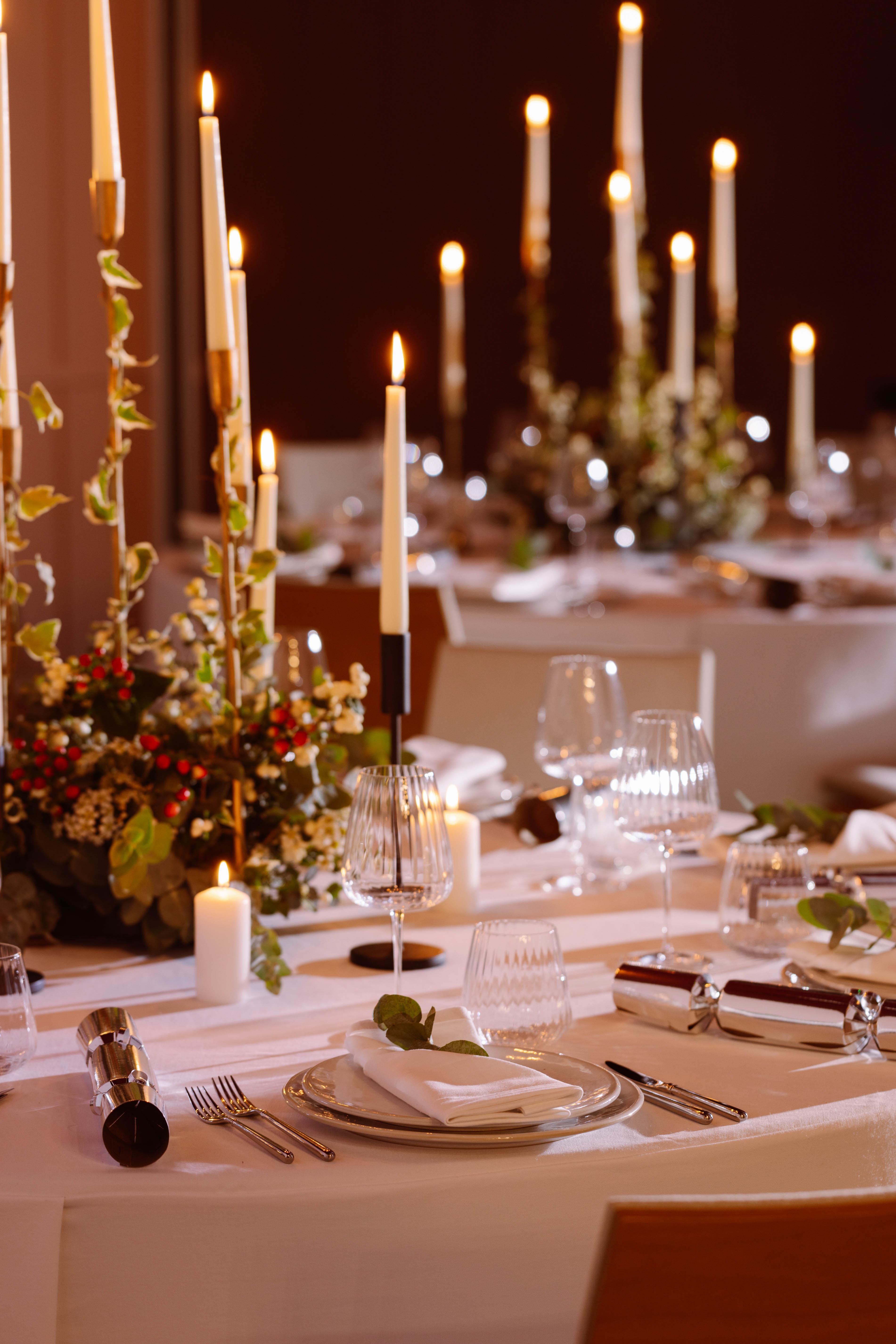 Elegant dining table with candles in Creative Room 1, perfect for sophisticated events.