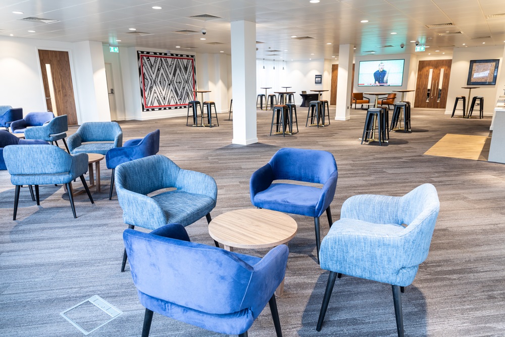 Modern meeting space with flexible seating for workshops and networking events.