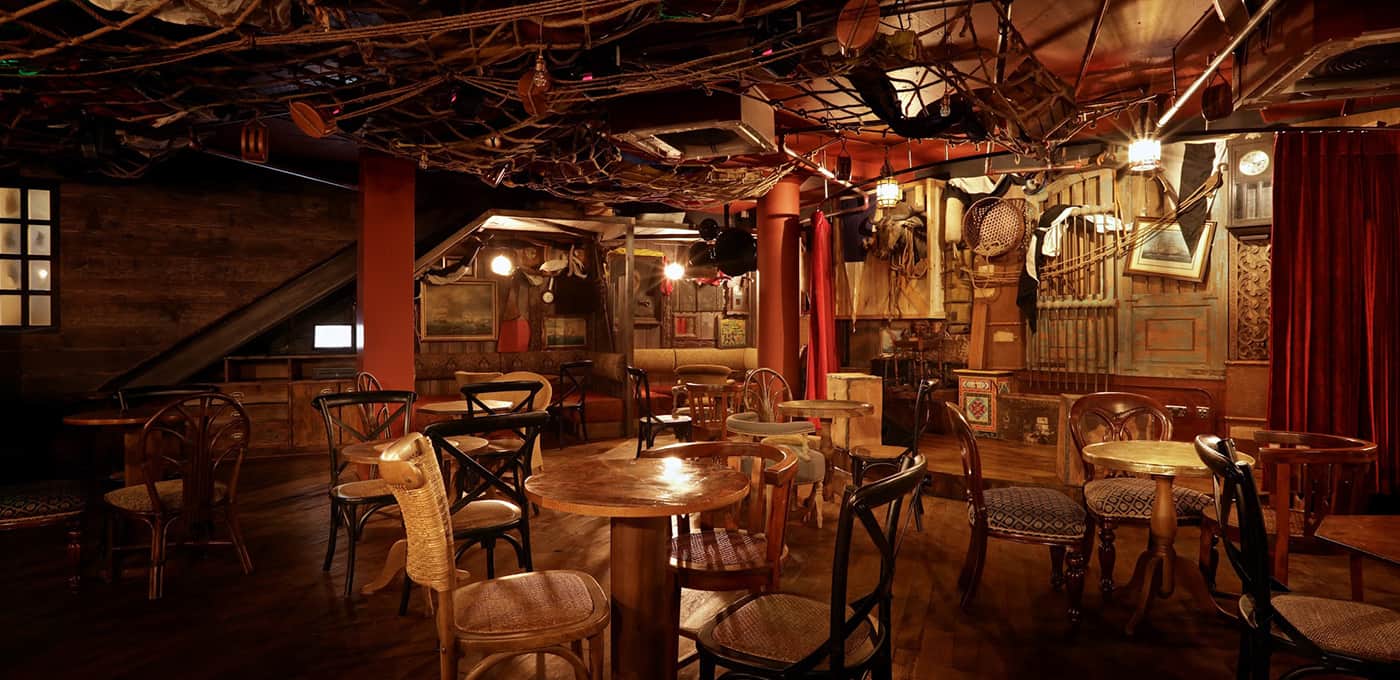 Eclectic event space with rustic decor at Mr Fogg's City Tavern for gatherings and brainstorming.