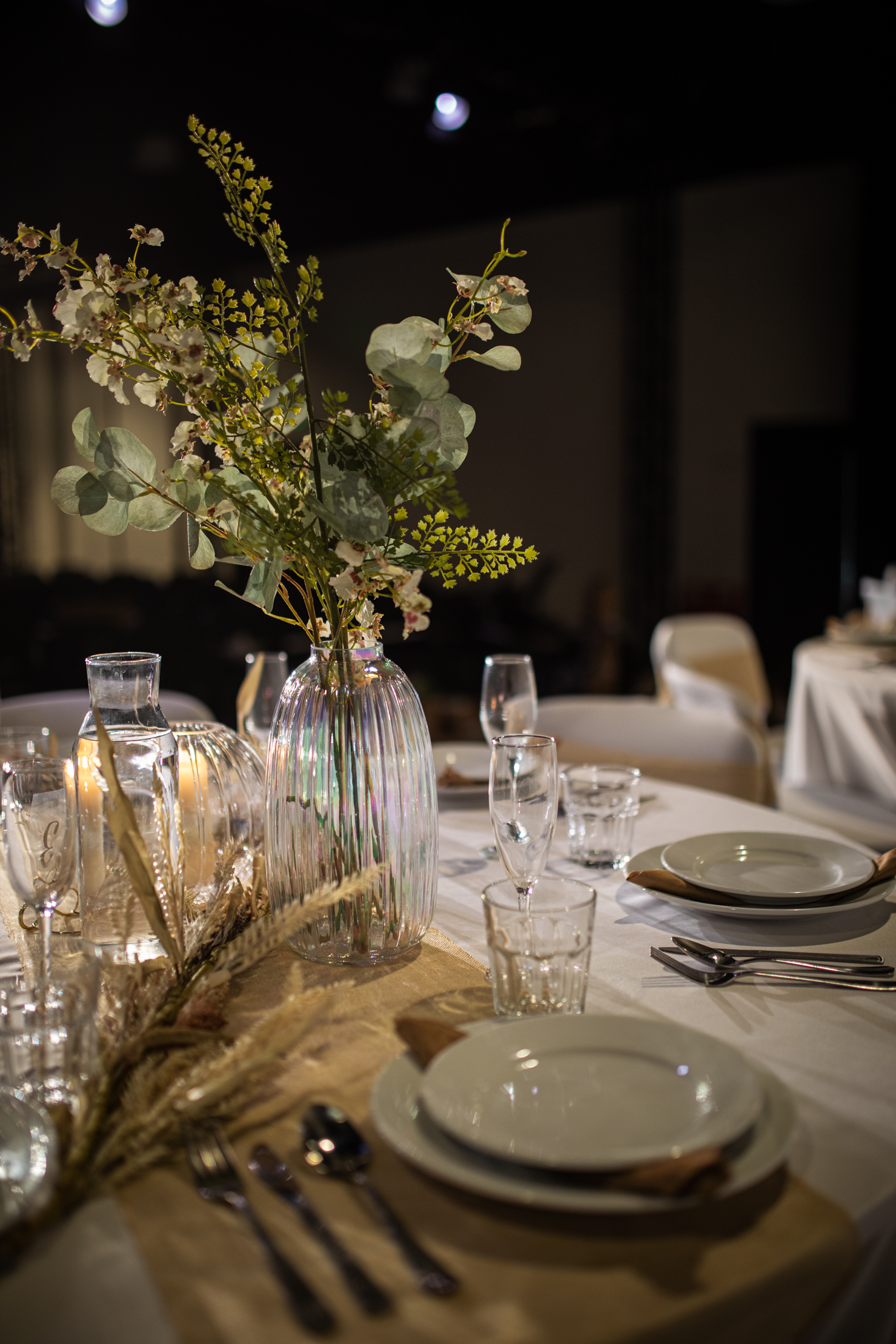 Elegant dining table with flowers in Black Box Theatre for weddings and upscale events.