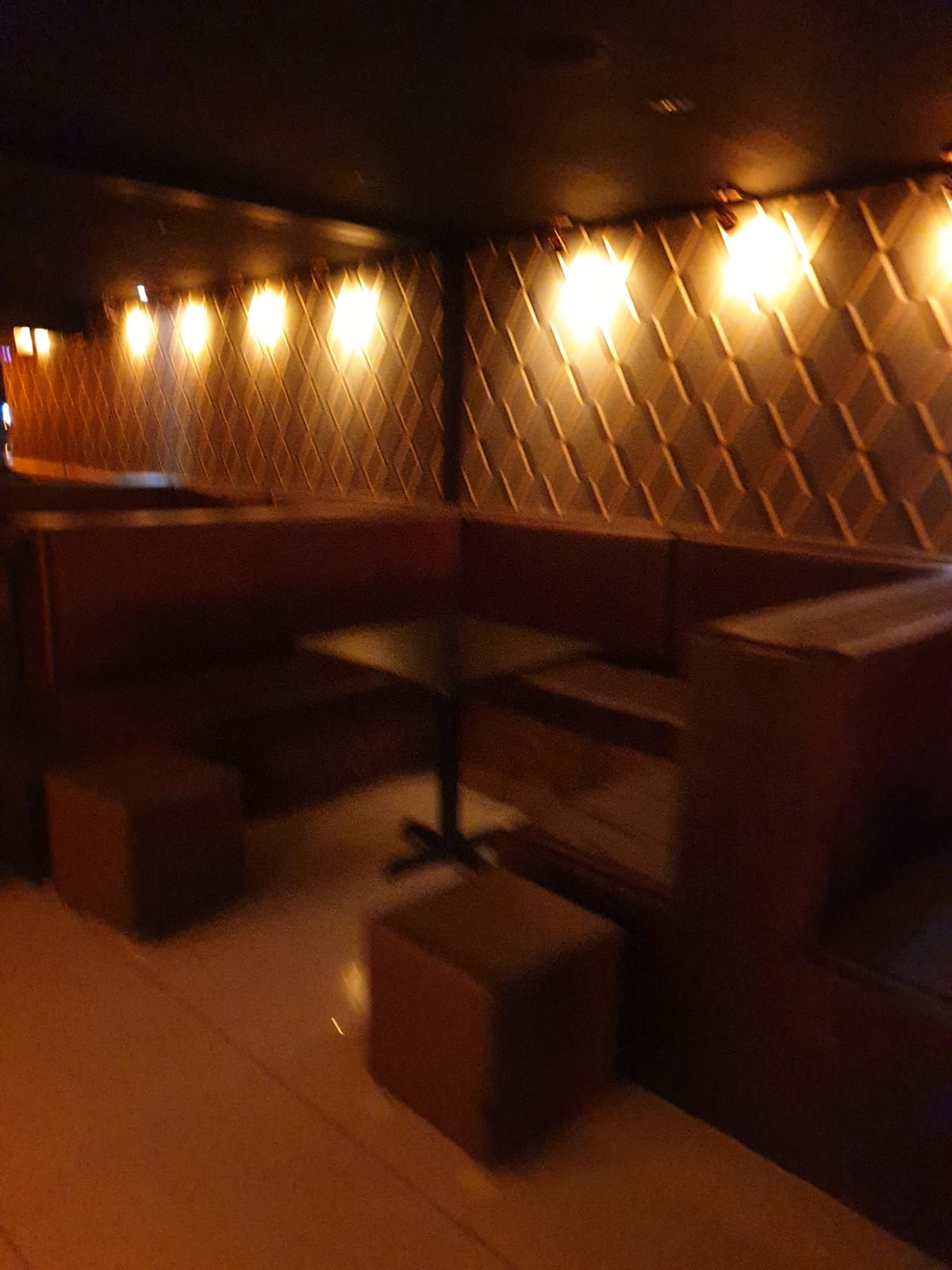 Cozy seating area in Miniature Restaurant, ideal for networking events and meetings.