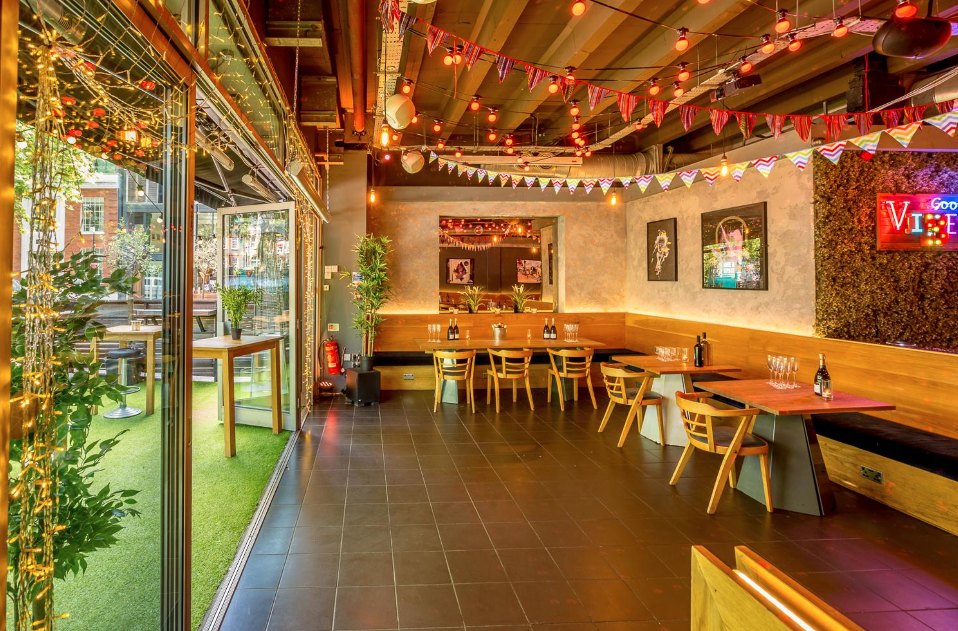 Vibrant event space with greenery, ideal for meetings and celebrations at Colours Hoxton.