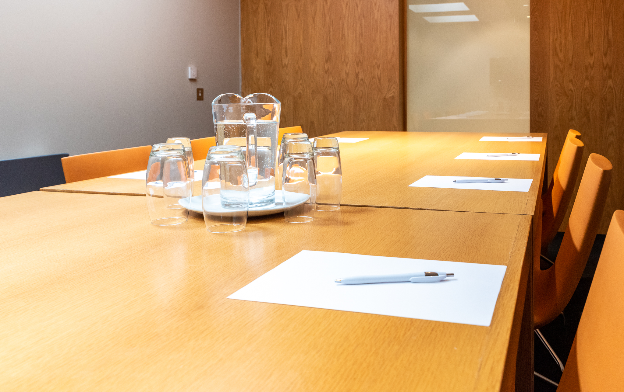 Conference room Harrogate with polished table, notepads for business meetings.