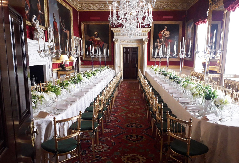 Elegant banquet hall at Spencer House with floral centerpieces for corporate events.