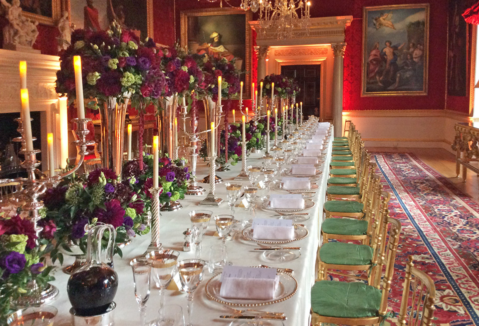 Elegant banquet table with floral arrangements in Spencer House for gala dinners.