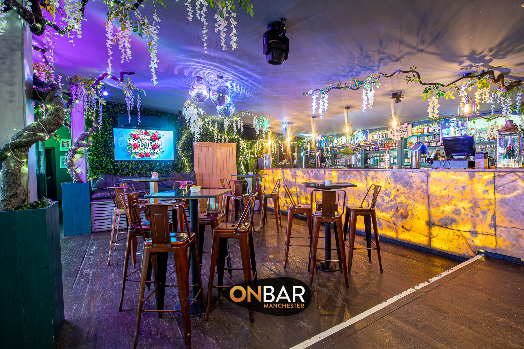 Vibrant ONBAR Manchester event space with modern bar, ideal for social gatherings.