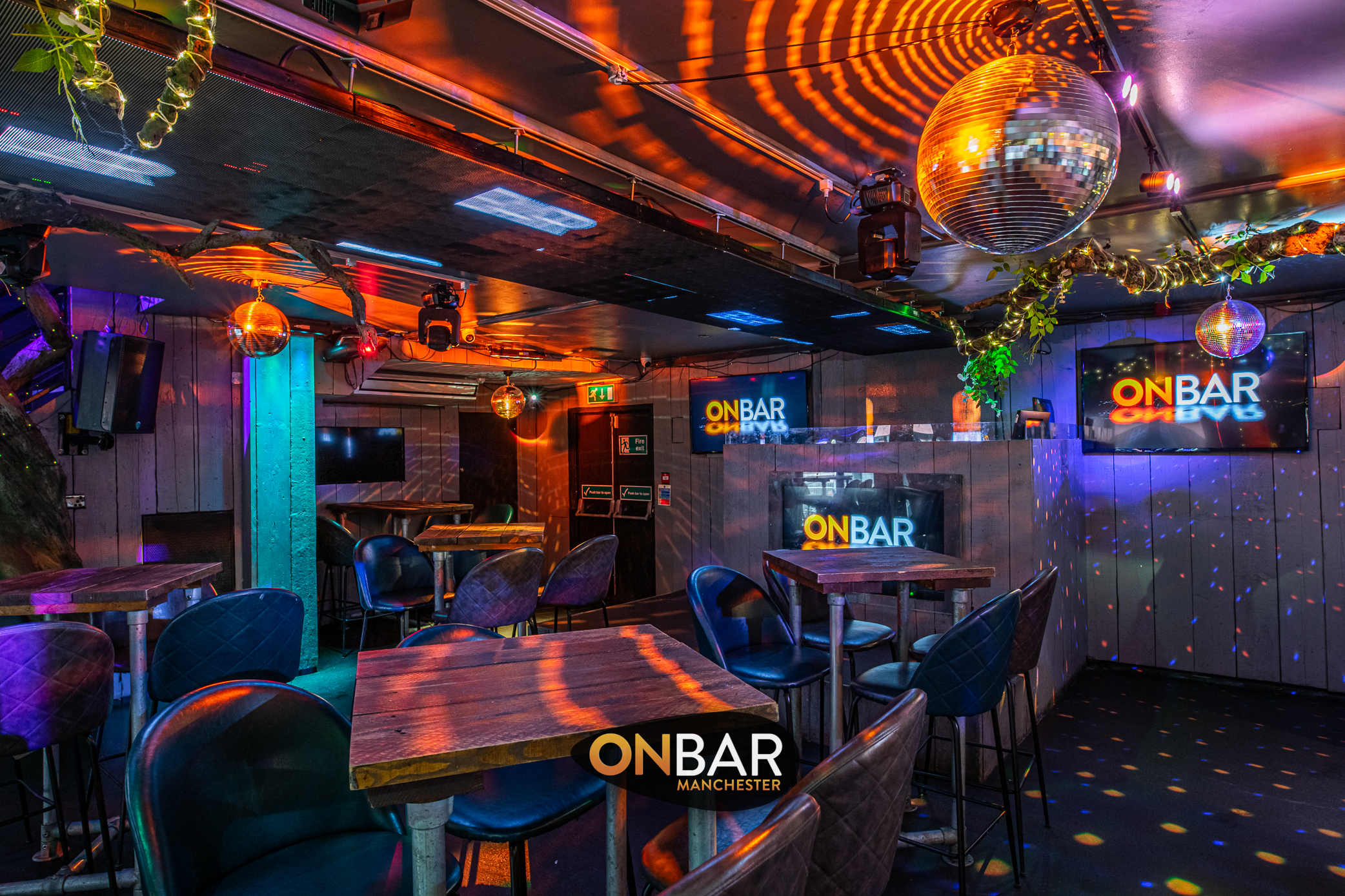 Vibrant ONBAR Manchester event space with disco ball, perfect for parties and corporate events.