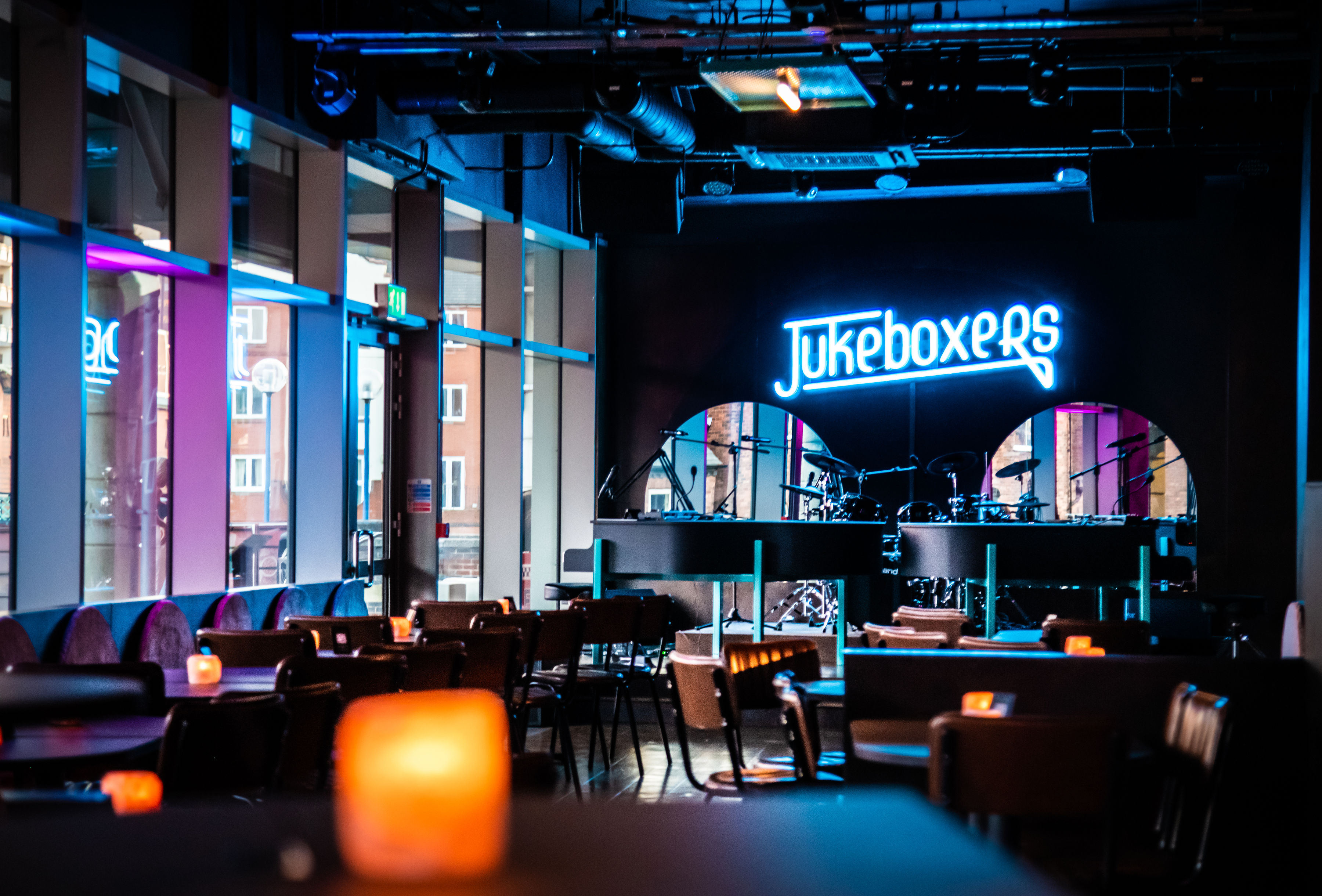 Vibrant event space with modern decor at Jukeboxers Duelling Piano Bar for gatherings.