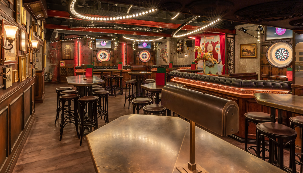 Vibrant event space at Flight Club Islington with dartboards for social mixers.