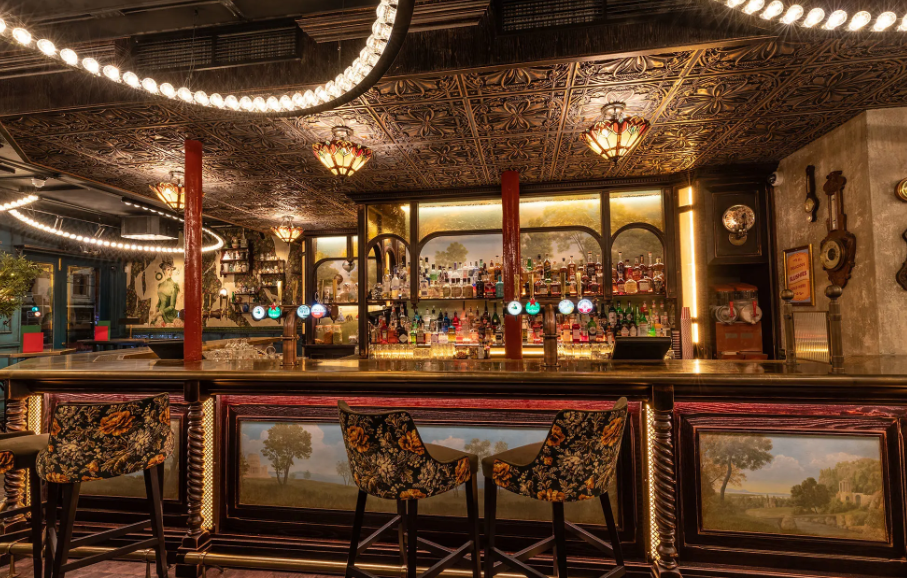 Stylish bar area with ornate decor at Flight Club Islington, ideal for networking events.