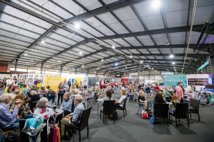 Royal Welsh Showground bustling with attendees at a vibrant exhibition event.