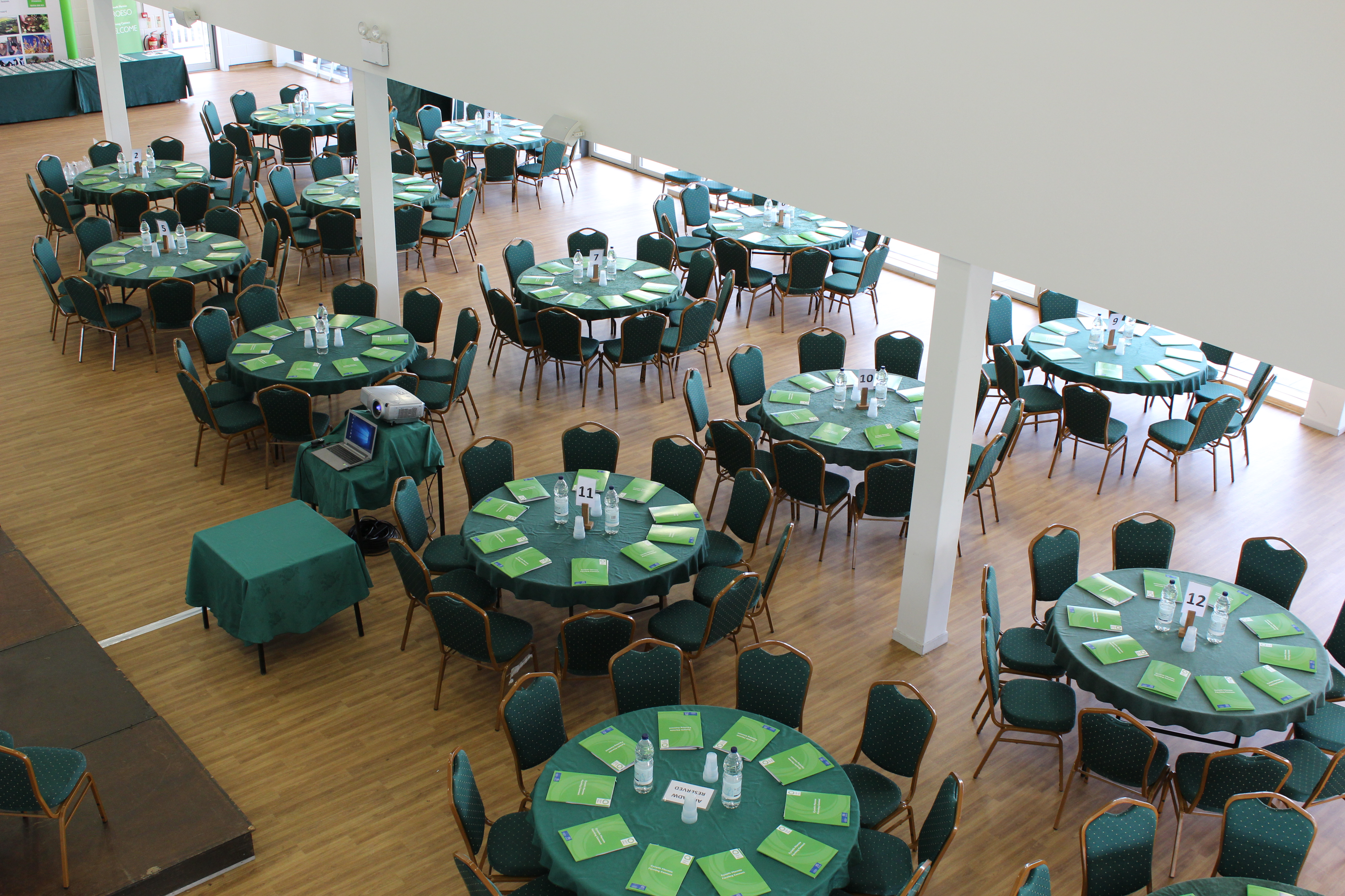Members Centre at Royal Welsh Showground, spacious banquet venue with green table linens.