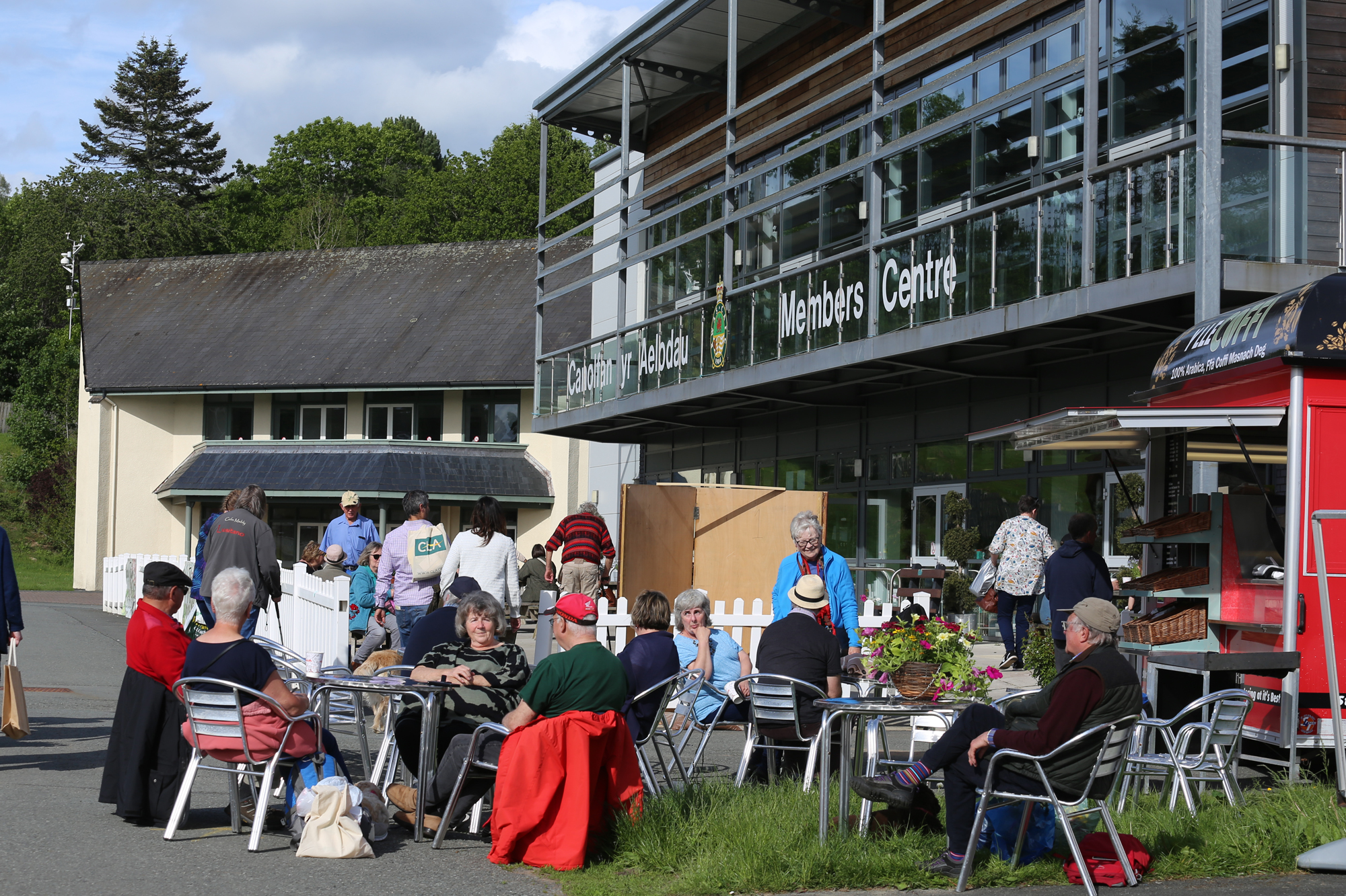 Vibrant outdoor gathering at Members Centre, Royal Welsh Showground for community events.