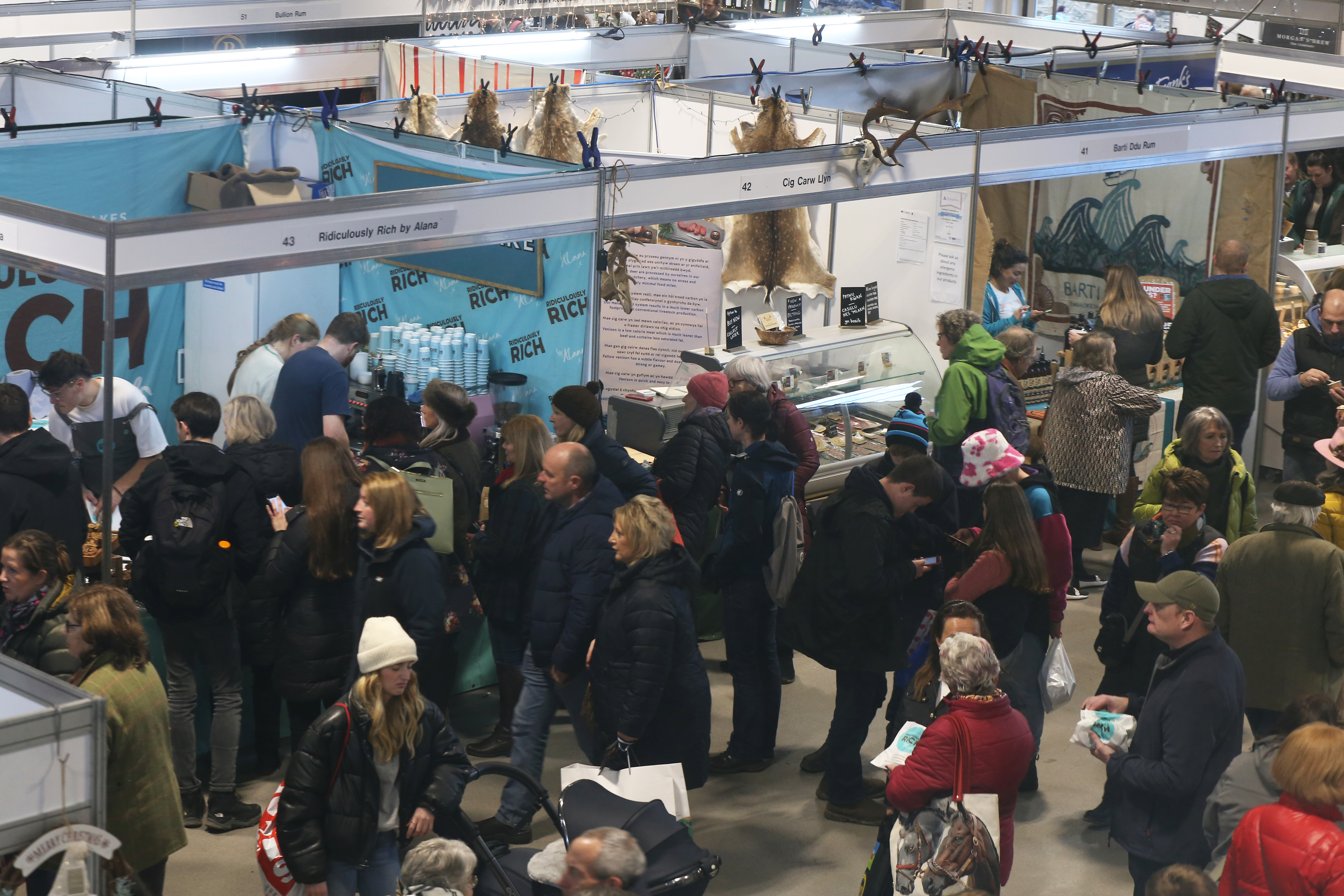 Food Hall at Royal Welsh Showground, bustling trade show with diverse attendees.